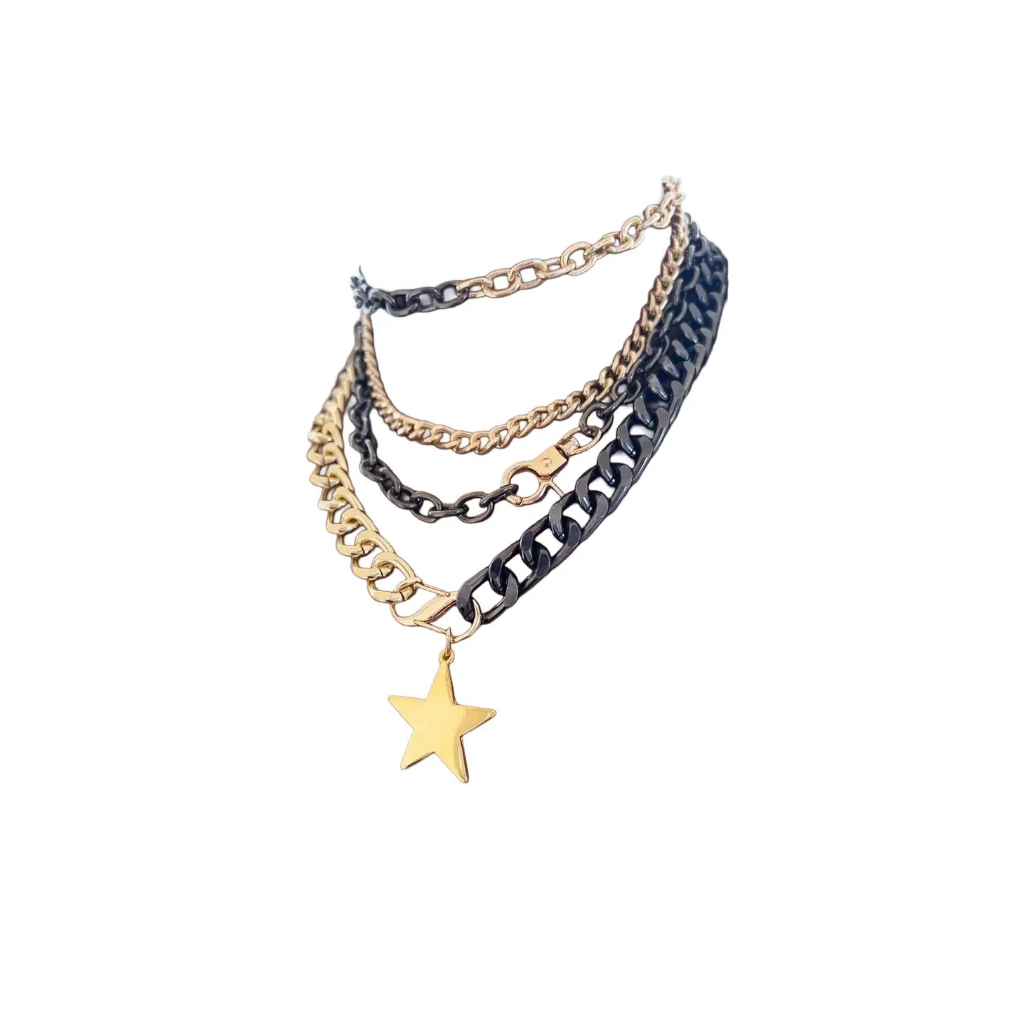 Layered black and gold chain necklace with chunky links and a gold star pendant on a white background.