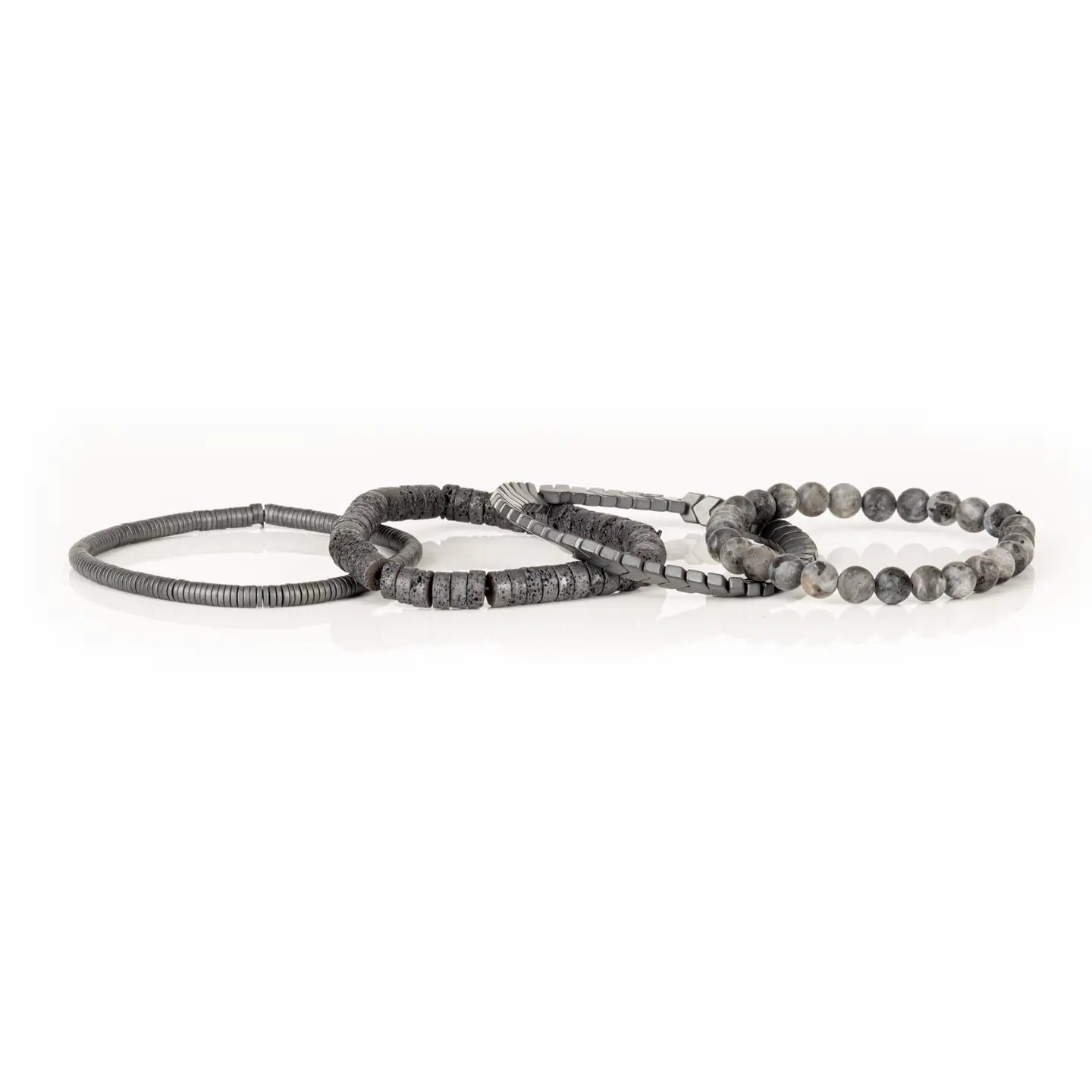 Men’s layered bracelet set featuring gray natural stone beads, gunmetal chevron metal beads, dark lava stone disc beads, and silver-tone coil wrap accents, stacked in a sleek monochromatic industrial luxury design on a white background.