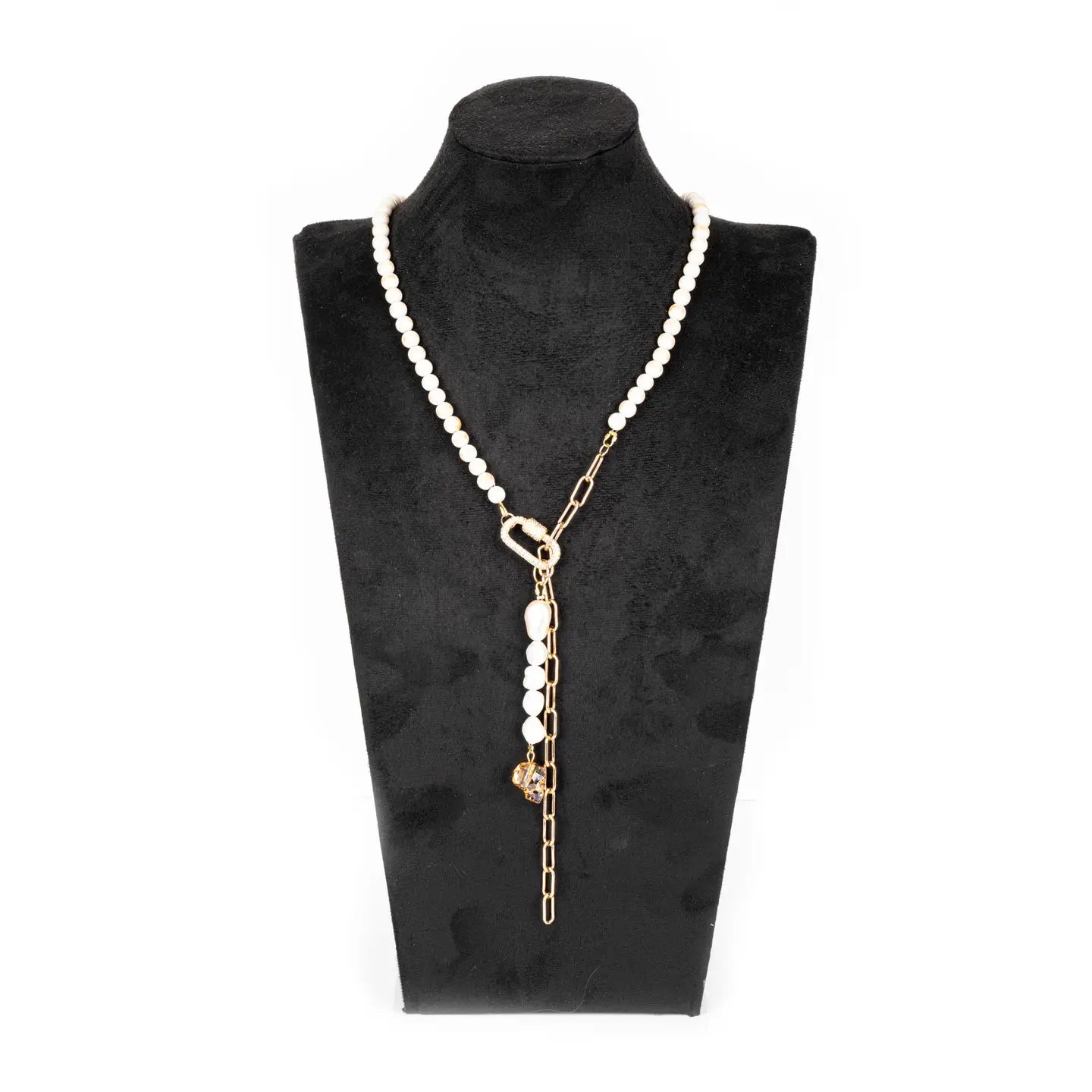 Pearl necklace with gold chain drop detail and crystal accent on white background.