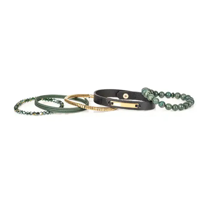 Men’s layered bracelet set featuring green natural stone beads, a black leather cuff with a gold-tone ID plate, olive braided cord wraps, gold-tone heishi beads, and faceted green crystal beads, stacked in a refined earthy luxury design on a white background.