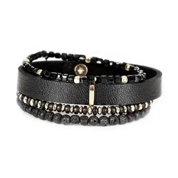 Men’s layered bracelet set featuring a black textured leather cuff, faceted black crystal beads, matte black lava stone beads, metallic hematite accents, and gold-tone spacer details, stacked in a refined black and gold luxury design on a white background.