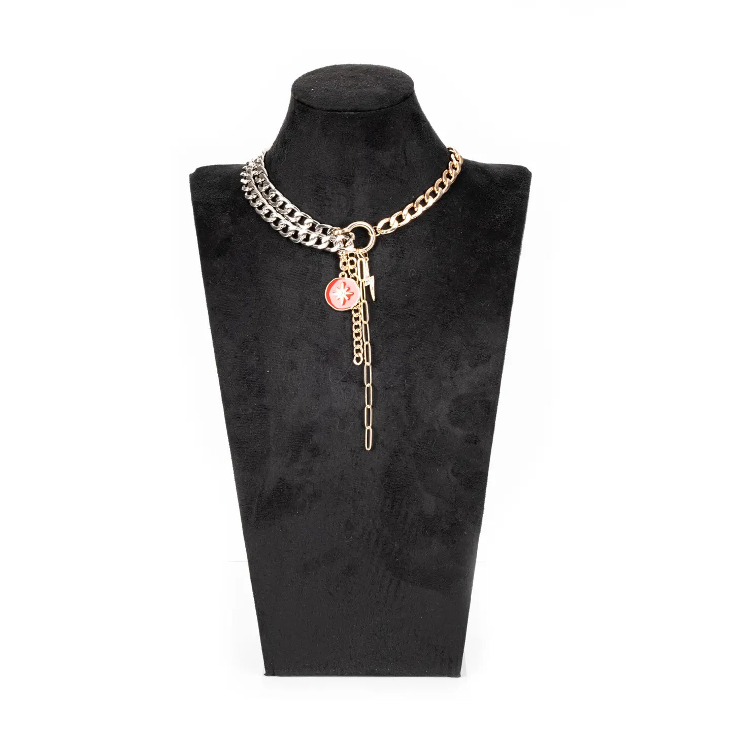 Mixed metal chain necklace with red charm and drop chain in gold and silver tones on white background.