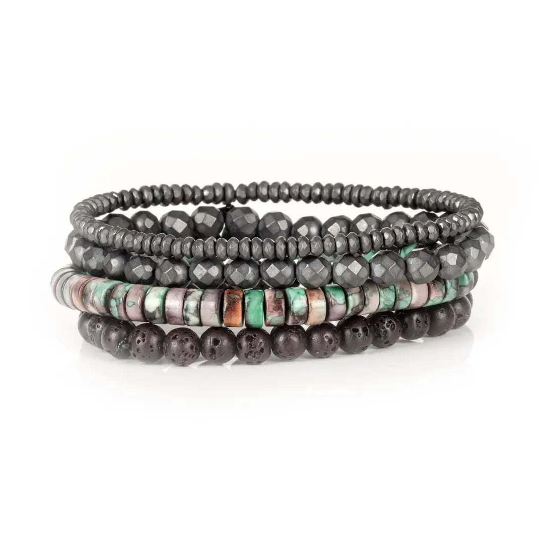 Men's layered bracelet set featuring faceted hematite beads, matte black lava stone beads, and natural heishi stone beads in turquoise, cream, mauve, and earthy brown tones arranged in a stacked design on a white background.