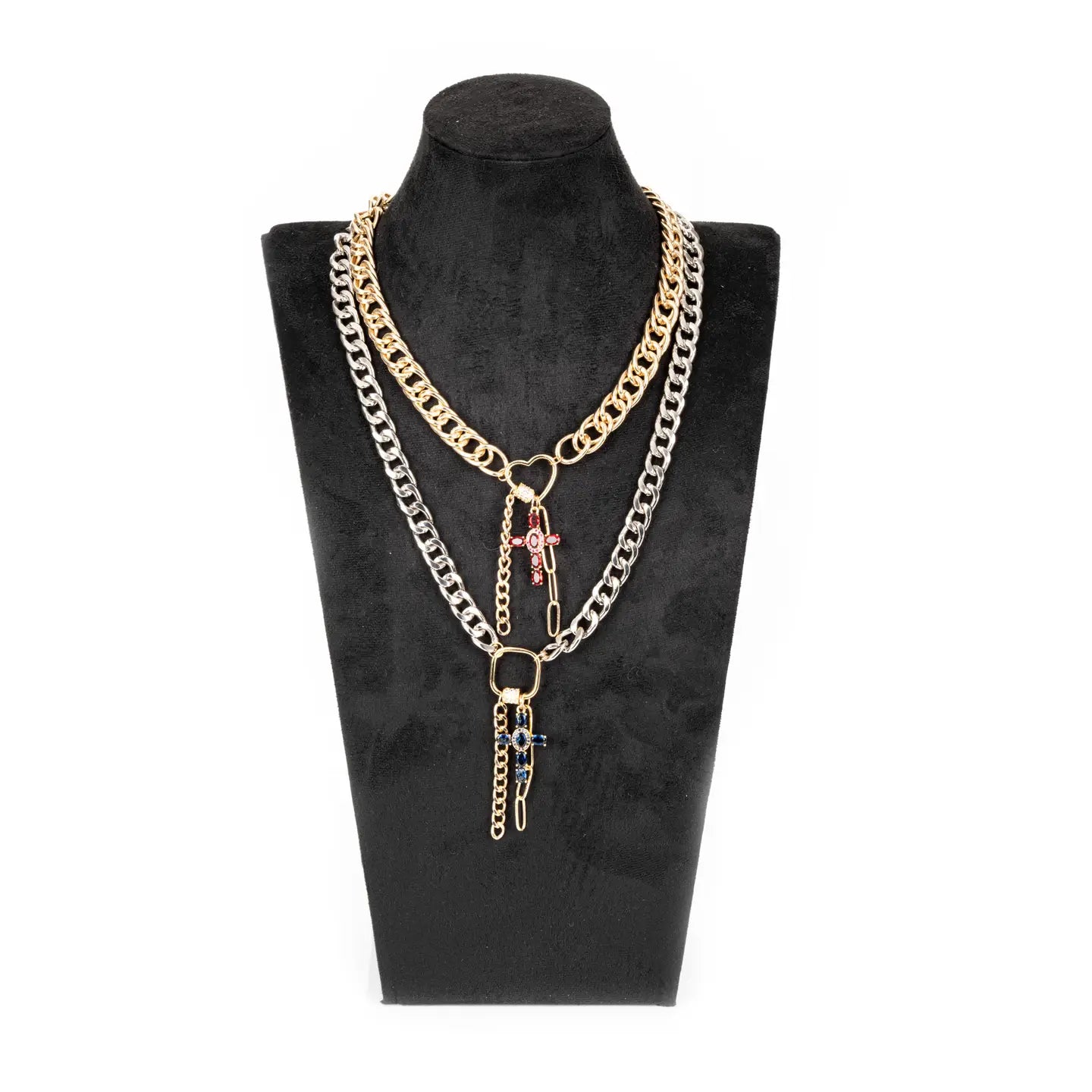 Mixed metal chain necklace with red and blue cross charms and layered drop chains on white background.