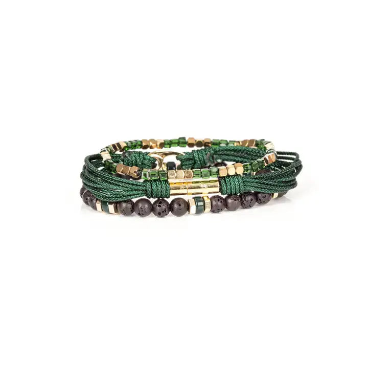Men’s layered bracelet set featuring dark green braided cord, green crystal beads, gold-tone geometric spacer beads, matte black lava stone beads, and a polished gold-tone centerpiece, stacked in a refined green and gold luxury design on a white background.