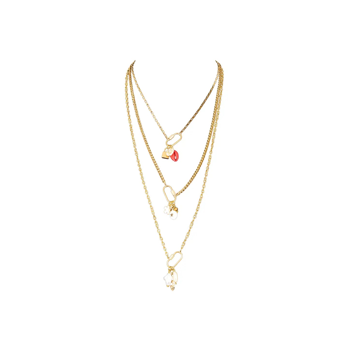Layered gold necklace with three chains and small charm details on white background.