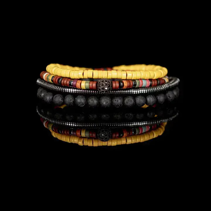 Men’s layered bracelet set featuring matte black lava stone beads, bright yellow heishi beads, multicolor tribal-inspired disc beads, a gunmetal pavé accent bead, and silver-tone coil wrap beads, stacked in a vibrant bohemian luxury design on a white background.