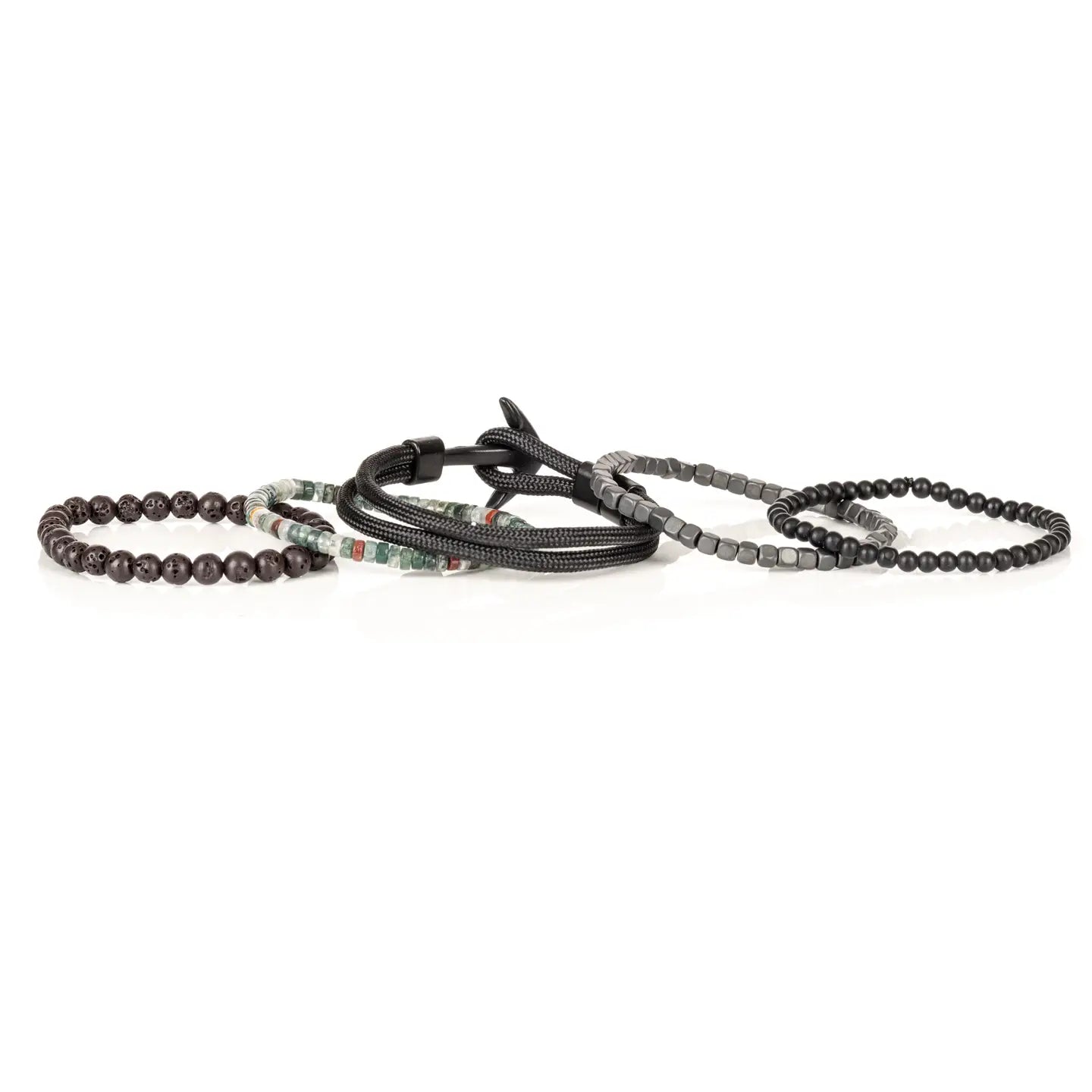 Men’s layered bracelet set featuring matte black bead strands, gunmetal cube beads, black braided cord wraps, dark lava stone beads, and green natural stone accent beads with subtle earth-tone details, stacked in a rugged contemporary luxury design on a white background.