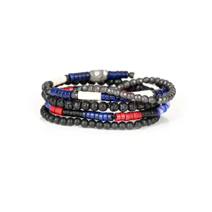 Black multi-layer men’s bracelet featuring lava stone beads, faceted hematite beads, blue cylindrical accents, red and white spacer details, and layered black bead strands on a light background.
