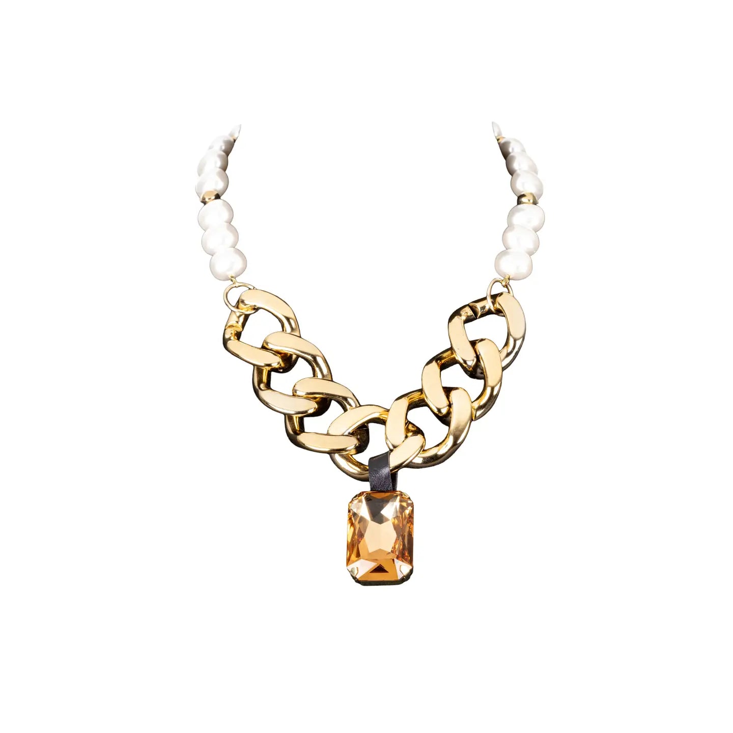 Gold chunky chain necklace with pearl detail and amber crystal pendant on white background.