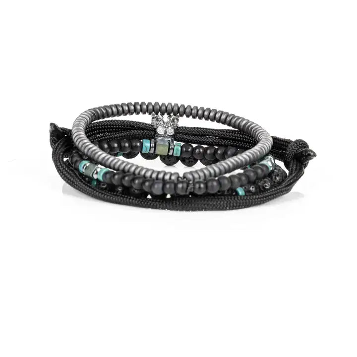 Black layered men’s bracelet set with lava stone beads, braided rope wraps, hematite accents, and turquoise detail on white background.