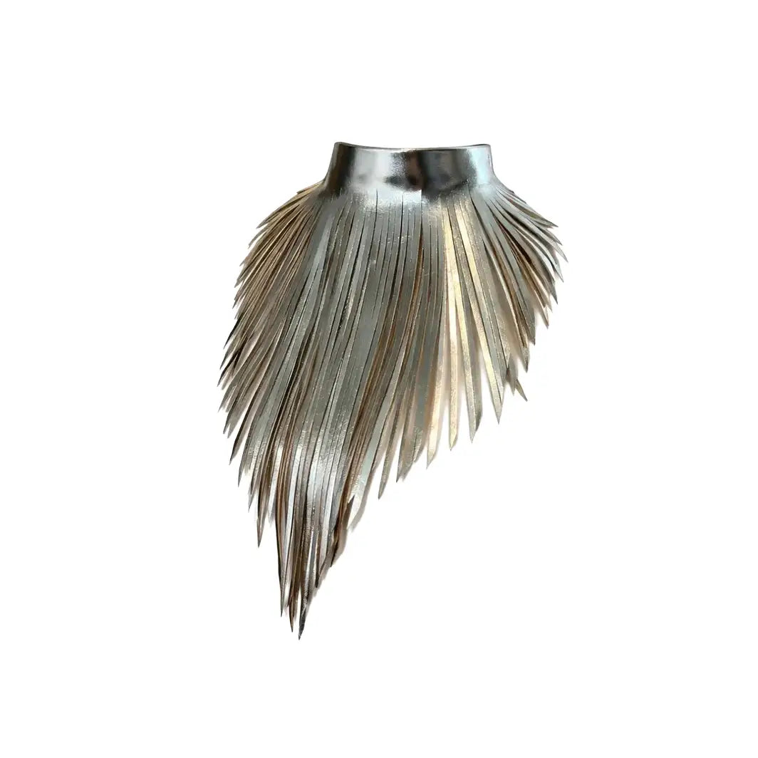 Metallic leather choker necklace with layered fringe in a sculptural asymmetrical design, displayed on a white background.