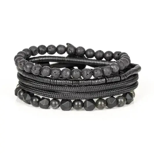 Black multi-layer men’s bracelet set featuring lava stone beads, faceted black onyx stones, braided rope layers, and layered metallic spacer accents on a light background.