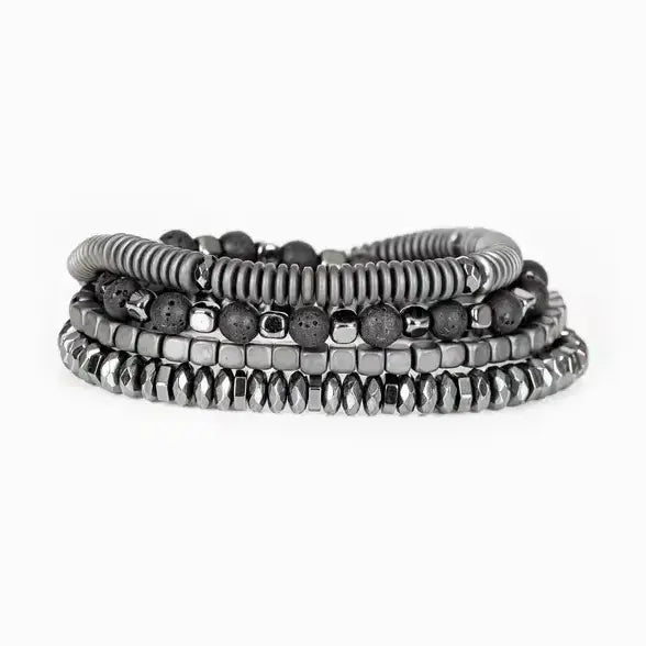 Men’s layered bracelet set featuring silver-tone coil wrap beads, matte black lava stone beads, polished hematite cube beads, faceted hematite crystal beads, and metallic spacer accents, stacked in a sleek industrial luxury design on a white background.