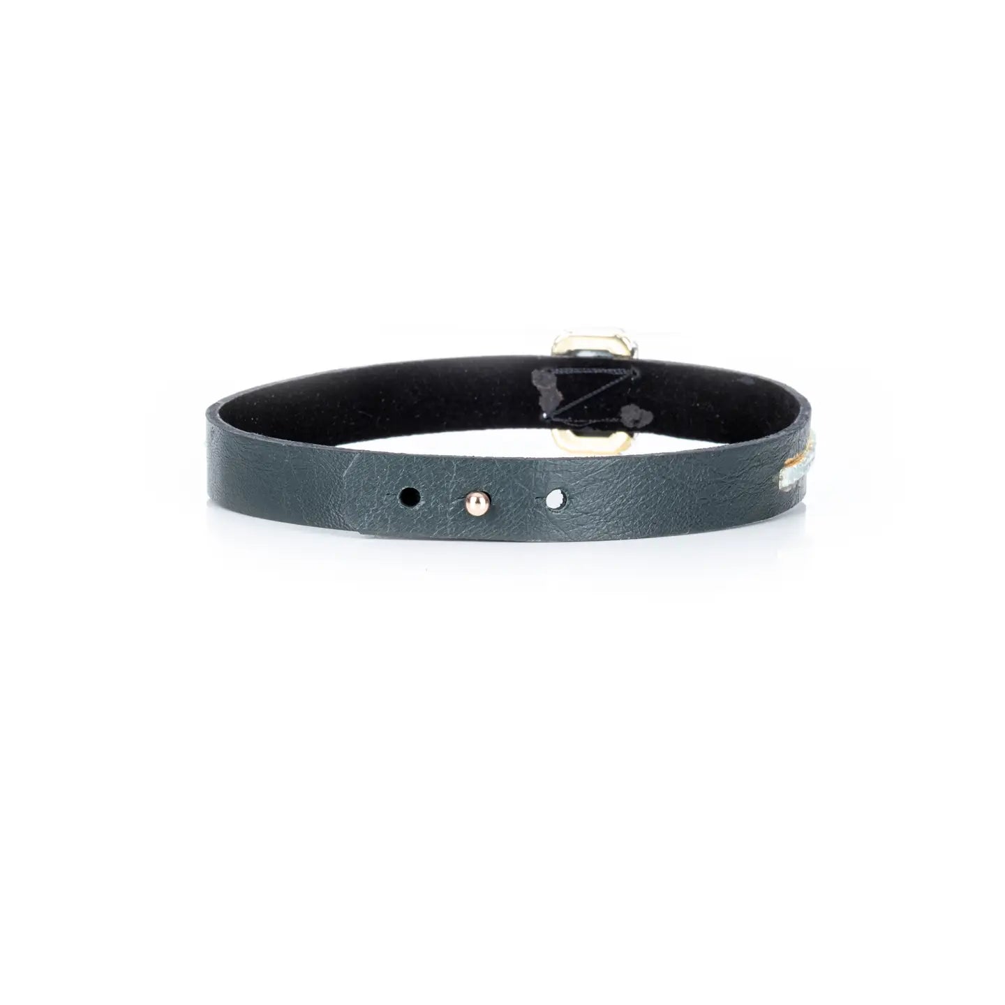 Black leather choker with a central rectangular white crystal and subtle gold and crystal detailing, displayed on a white background.