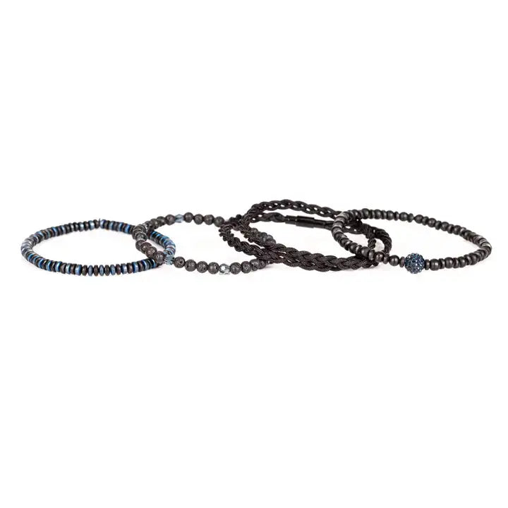 Black and blue multi-layer men’s bracelet featuring braided rope layers, lava stone beads, blue crystal centerpiece bead, faceted crystal accents, and blue metallic disc details on a light background.