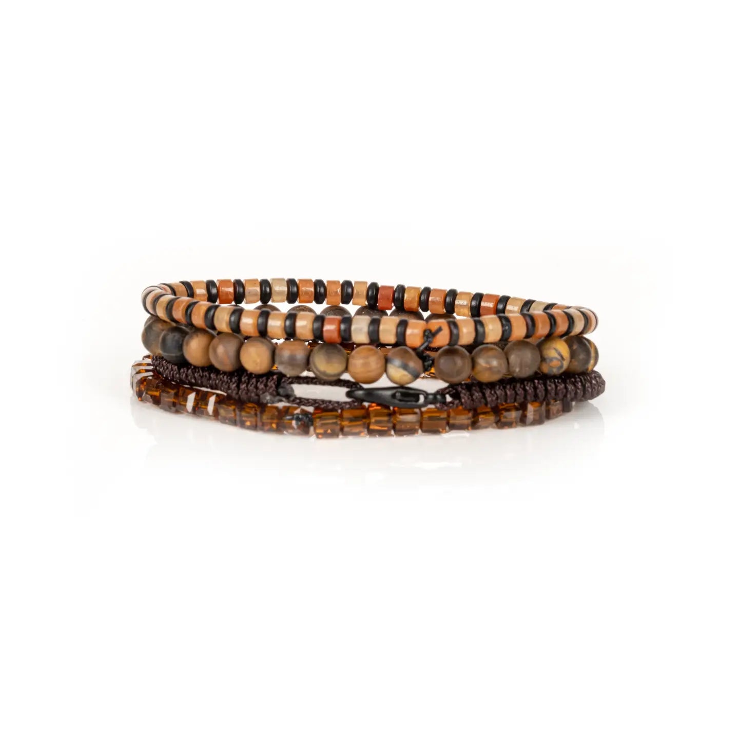 Men's layered bracelet set featuring genuine Tiger Eye stone beads, amber crystal accents, earth-tone heishi beads, and brown woven cord details arranged in a stacked design on a white background.