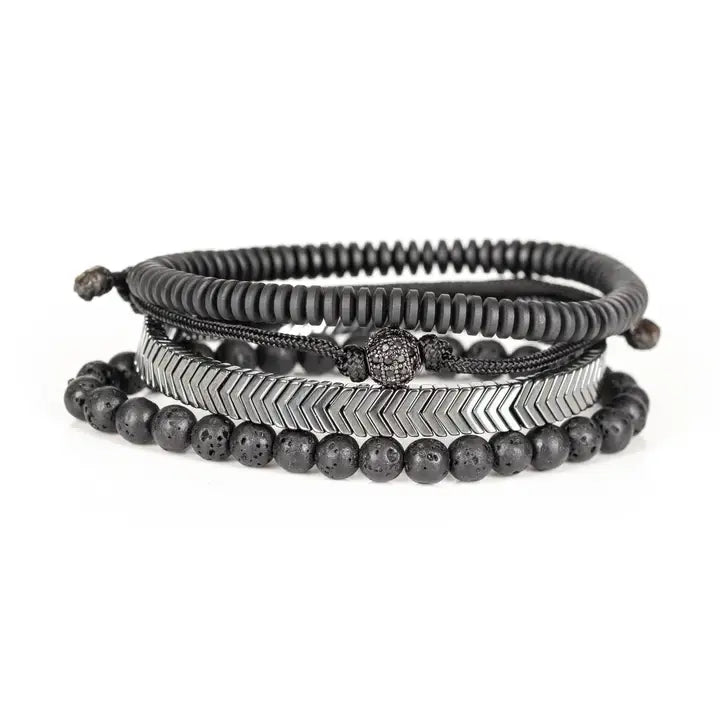 Black and silver layered men’s bracelet set with lava stone beads, silver chevron metal bar, matte black spacer beads, and pavé centerpiece on white background.