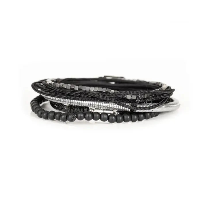 Black and silver layered men’s bracelet set with matte black beads, silver hematite-style spacers, braided rope wraps, and minimalist metallic centerpiece on white background.