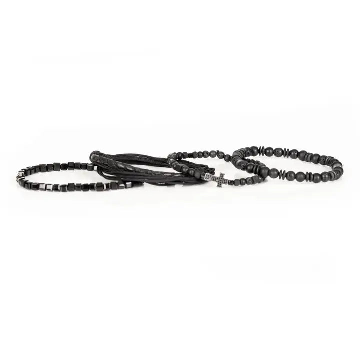 Black layered men’s bracelet set with lava stone beads, braided leather, rope wraps, faceted crystal accents, and pavé cross detail on white background