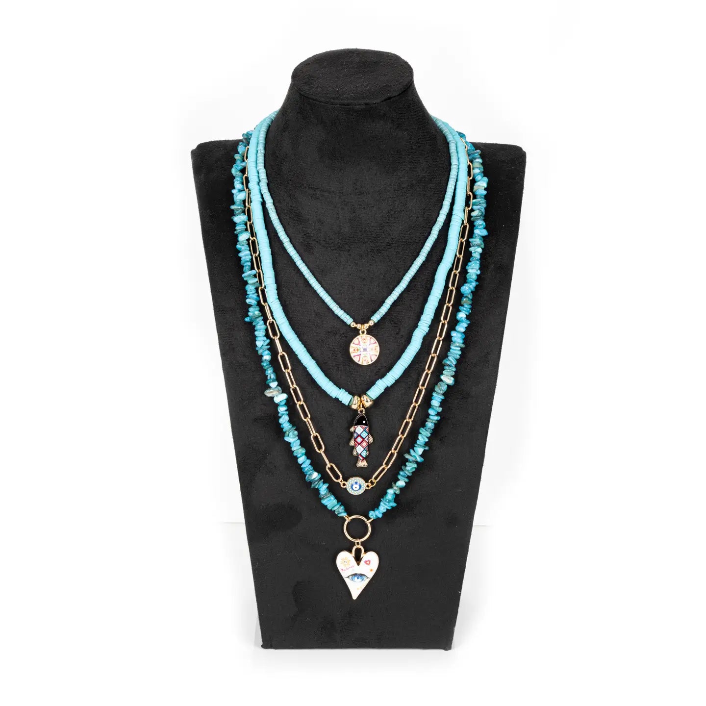Layered turquoise beaded necklace with multiple strands, gold chain accents, and charm pendants, displayed on a white background.