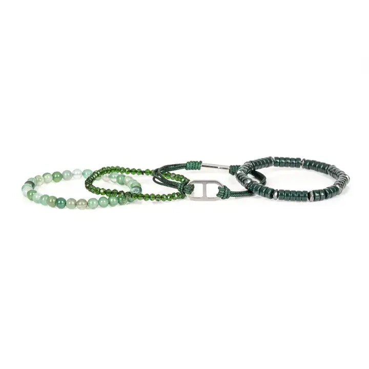 Men’s layered bracelet set featuring dark green heishi beads, green braided cord with a silver-tone centerpiece, faceted green crystal beads, and polished green natural stone beads, stacked in a sophisticated contemporary luxury design on a white background.