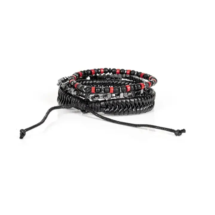 Black multi-layer men’s bracelet featuring glossy black disc beads, metallic hematite cube beads, matte black accents, and red bead details with adjustable cord closure on a light background.