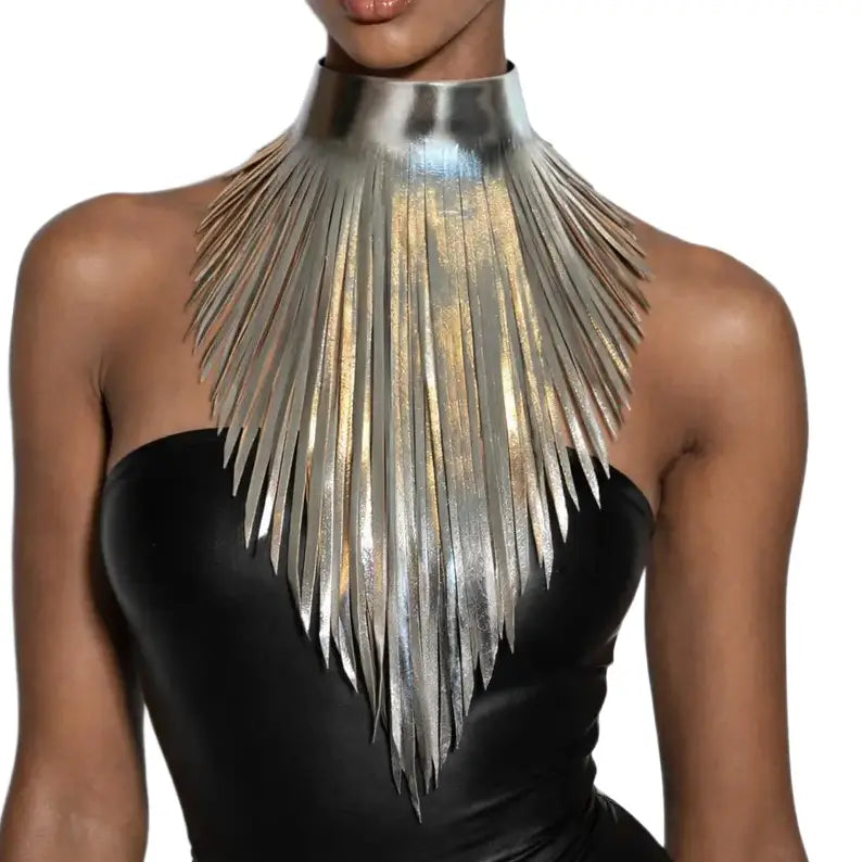 Metallic leather choker necklace with layered fringe in a sculptural asymmetrical design, displayed on a white background.