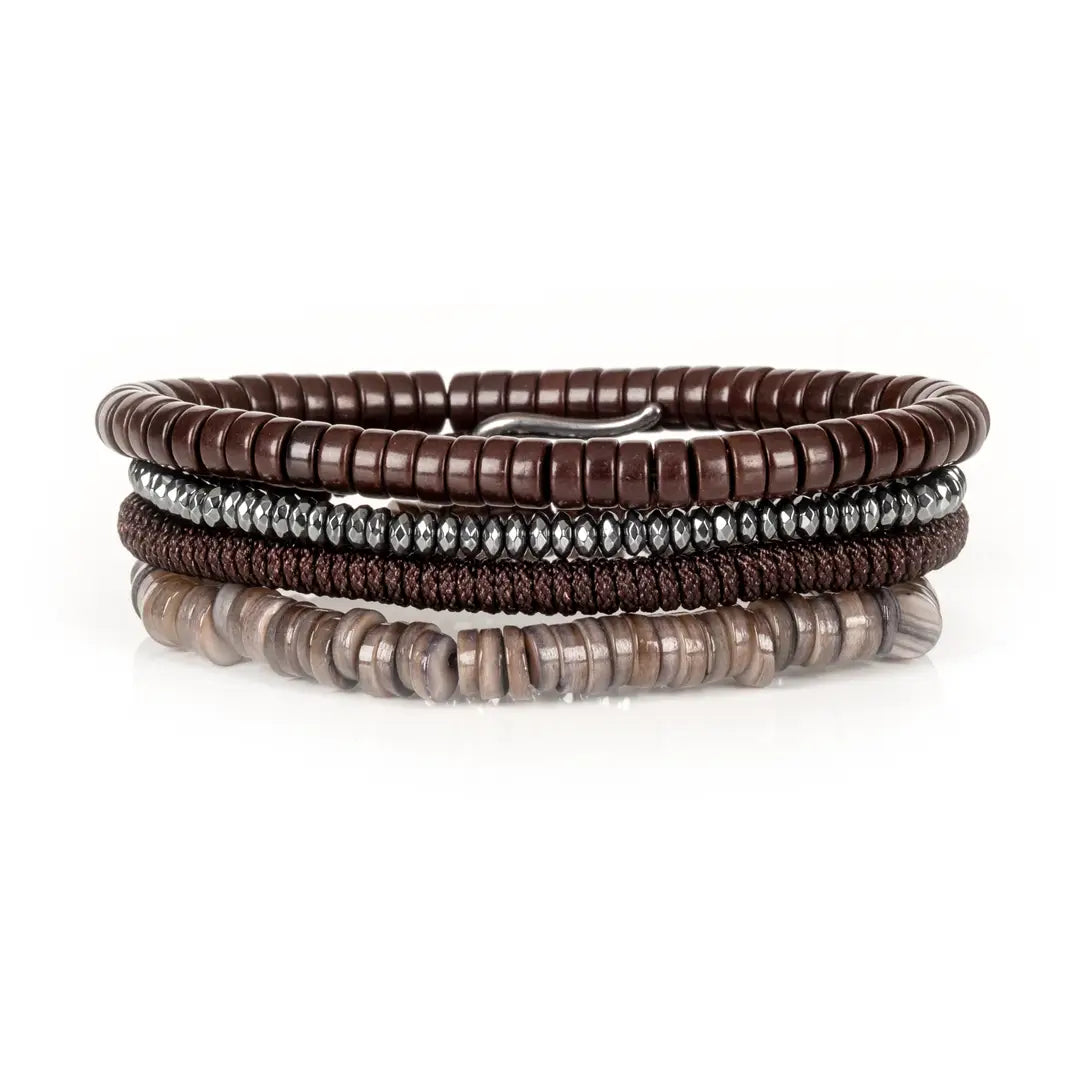Men's layered bracelet set featuring dark brown heishi beads, faceted hematite spacer beads, brown woven cord detailing, and taupe natural stone disc beads arranged in a minimalist stacked design on a white background.