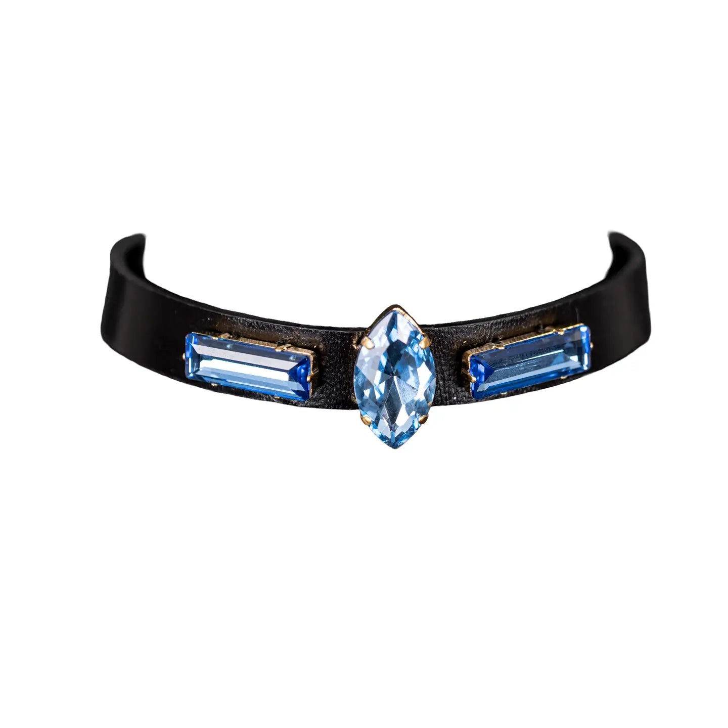 Black leather choker with a central marquise-cut blue crystal and two side baguette blue crystals, displayed on a white background.