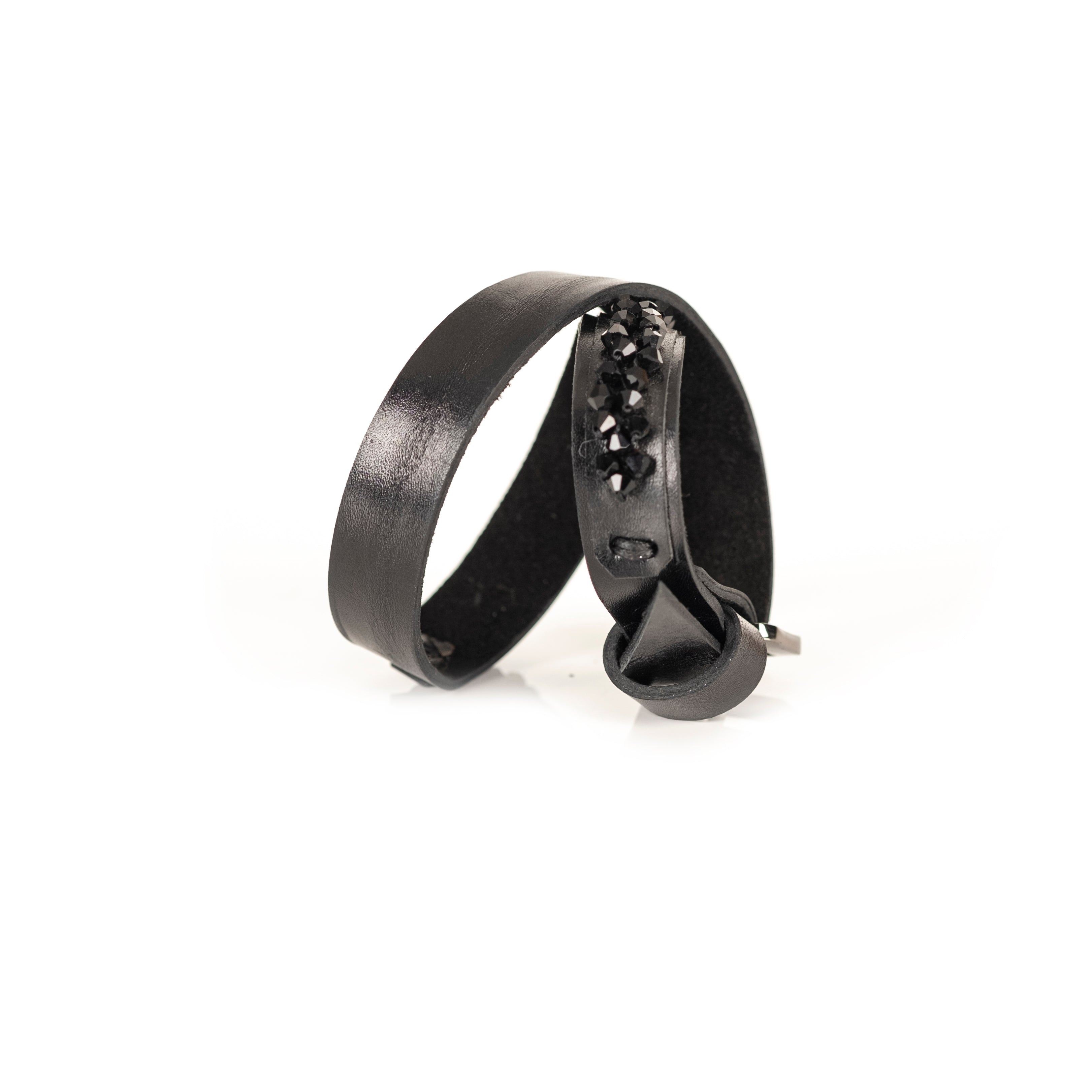 Minimalist black leather bracelet with faceted black crystal edge and buckle closure, handmade by THE DARK