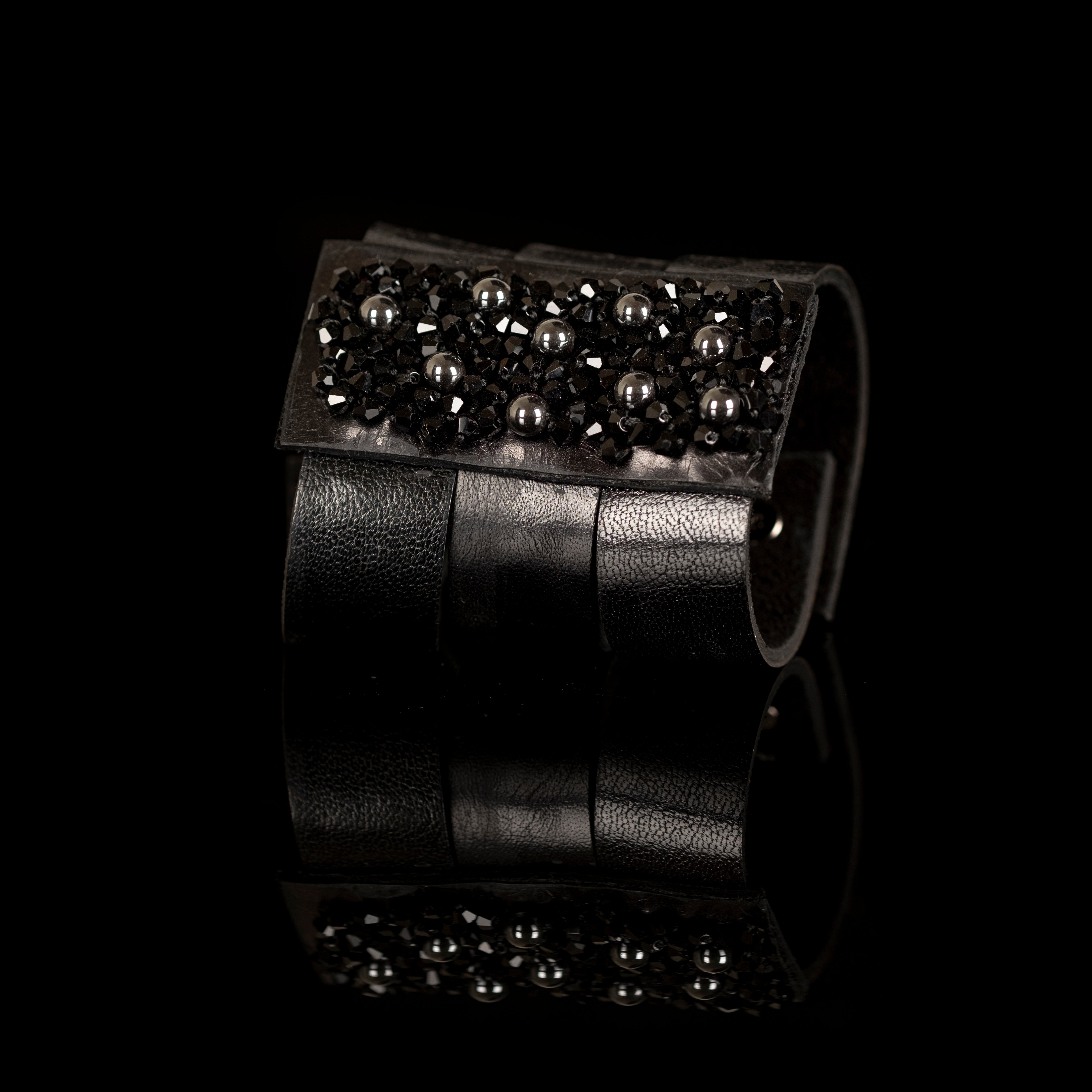 Black leather statement cuff bracelet with dense black crystal cluster and metallic beads, handmade bracelet by THE DARK