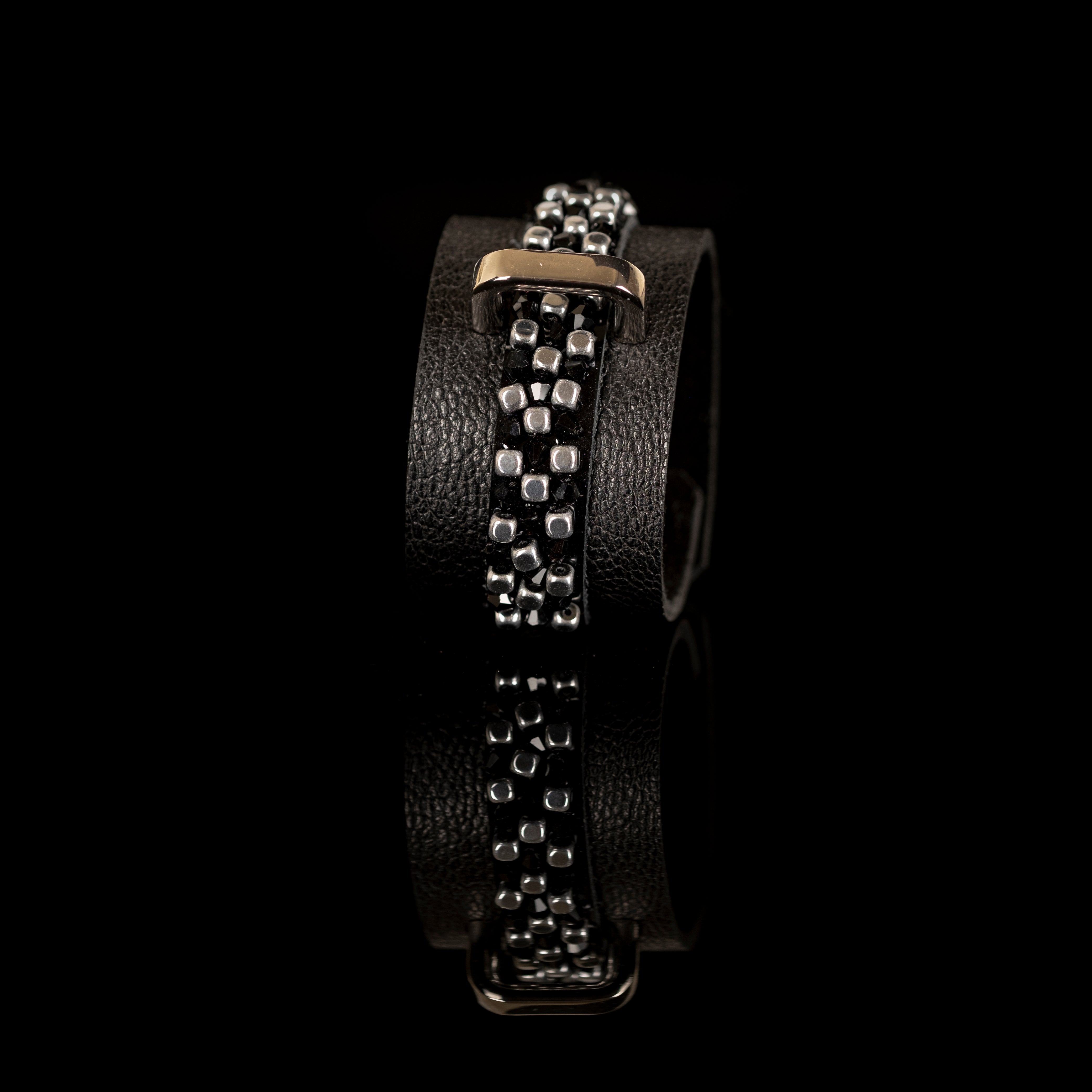 Black leather cuff bracelet with central grid of black crystals and silver beads, handmade statement bracelet by THE DARK
