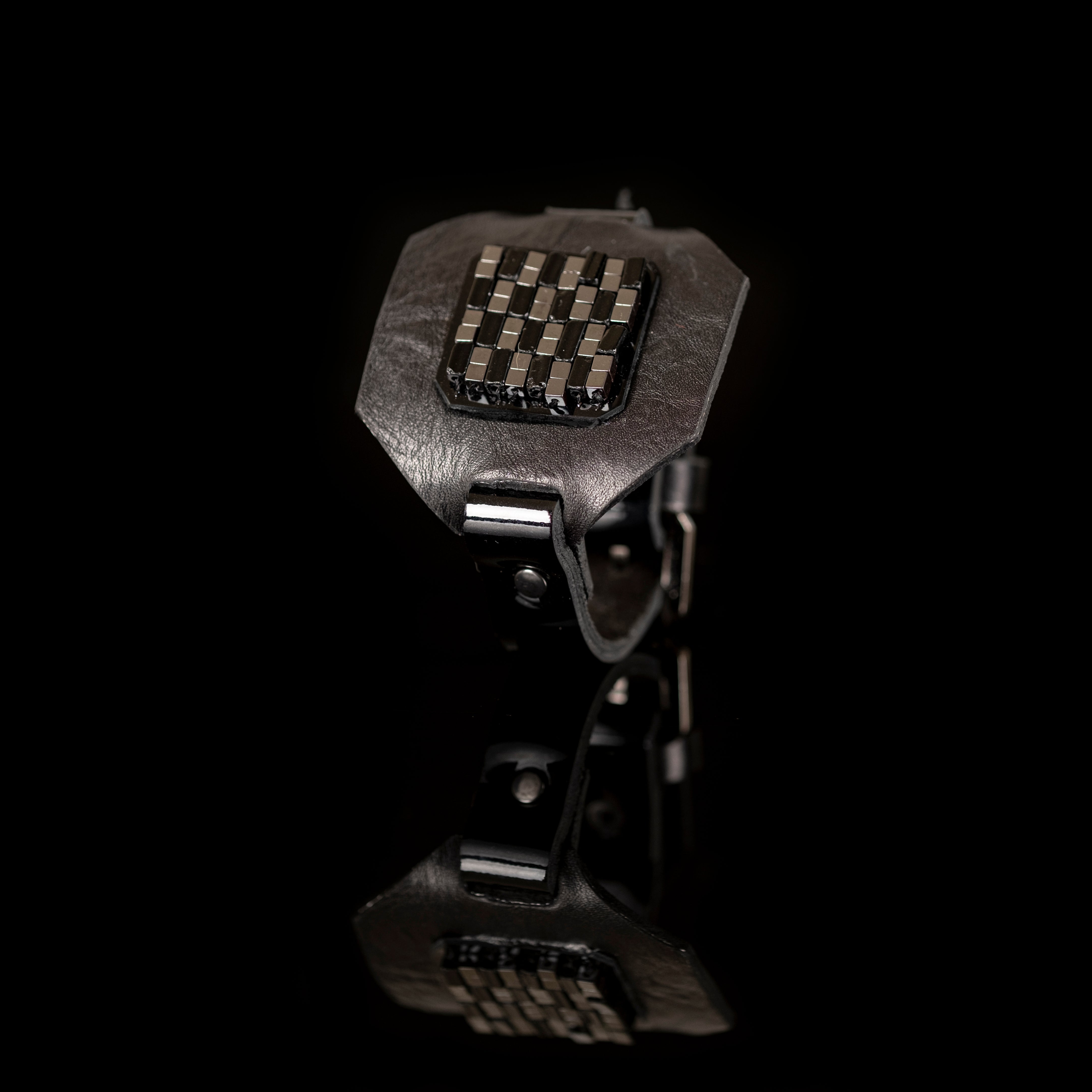 Black leather statement bracelet with geometric metal grid centerpiece, handmade dark fashion cuff by THE DARK