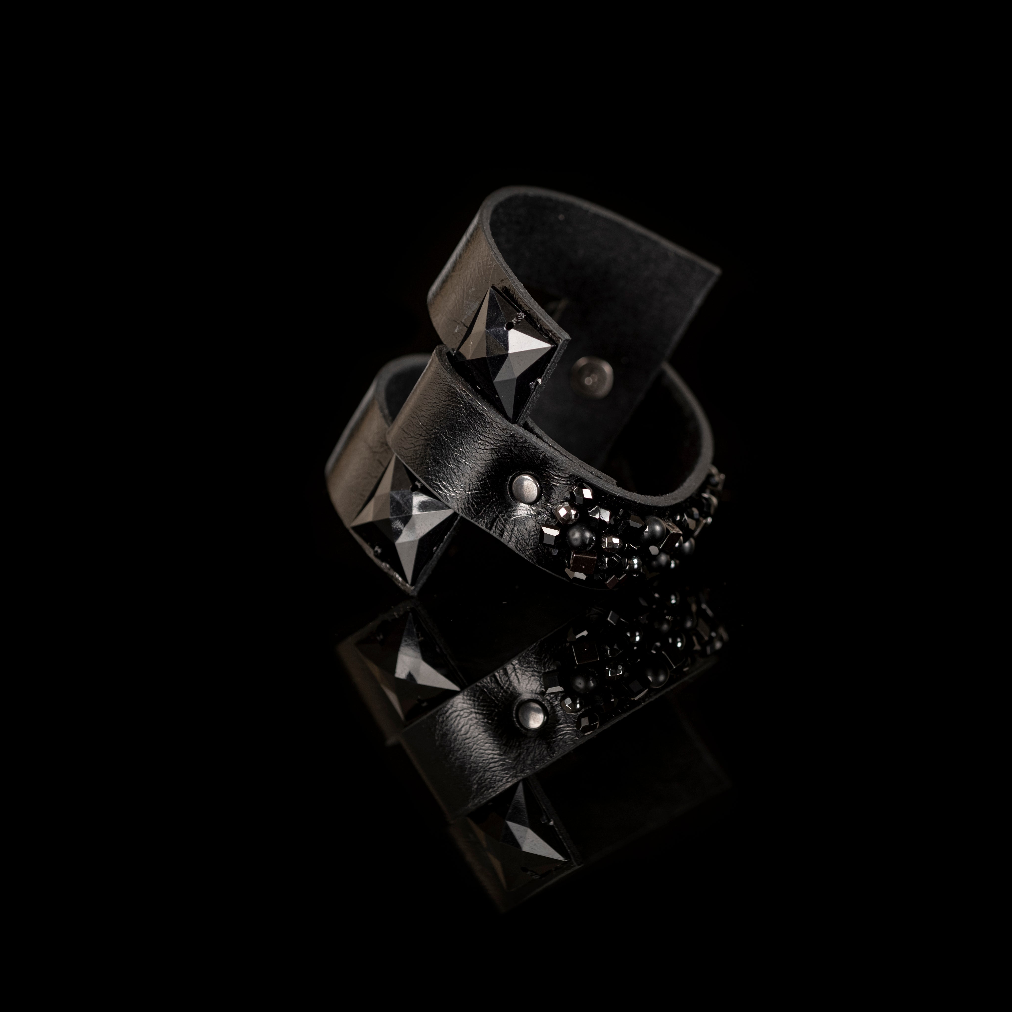 Black leather cuff bracelet with pyramid-cut black crystals and layered leather bands, handmade statement bracelet by THE DARK