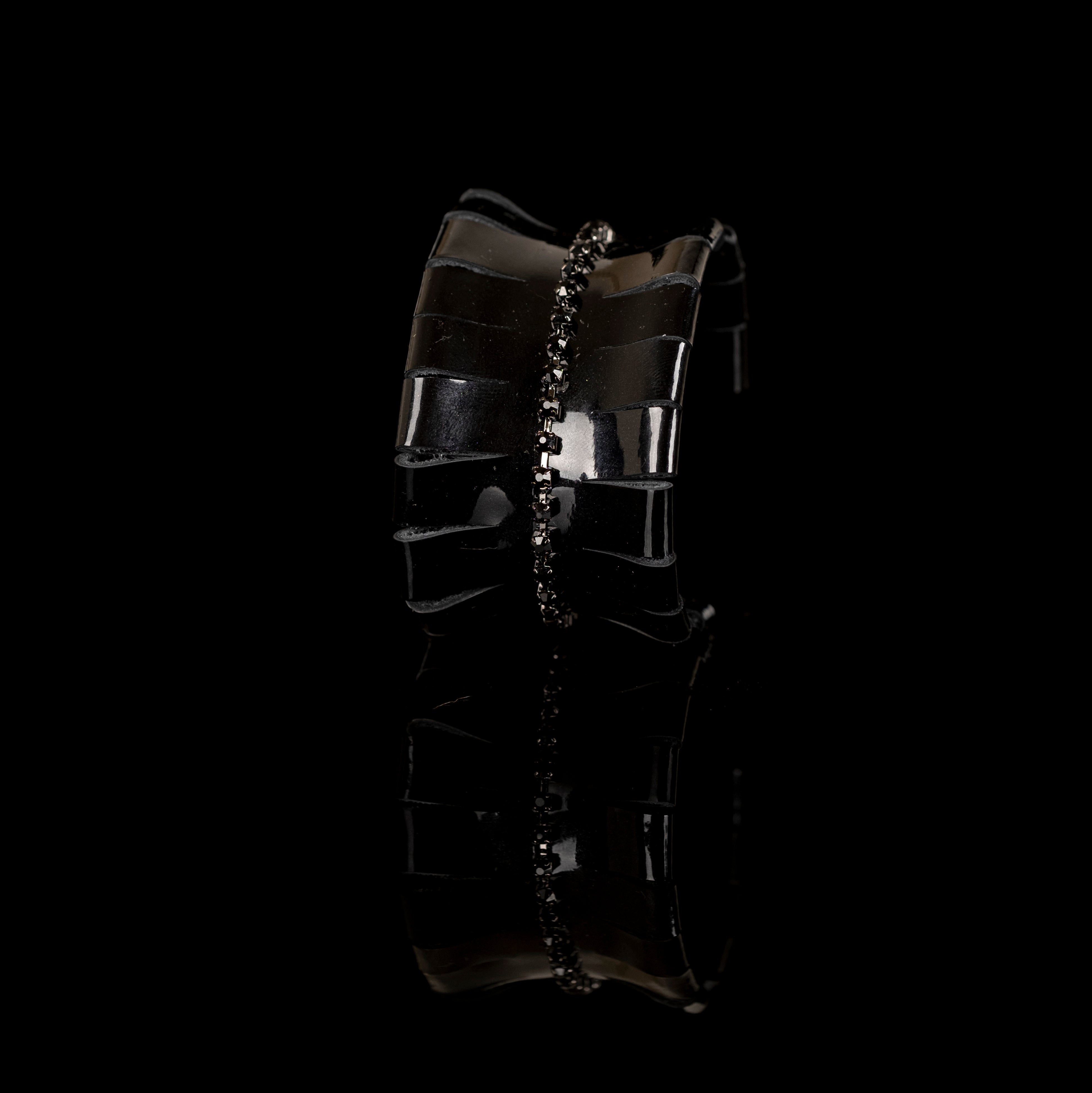 Black patent leather cuff bracelet with vertical black crystal chain detail, handmade statement leather bracelet by THE DARK