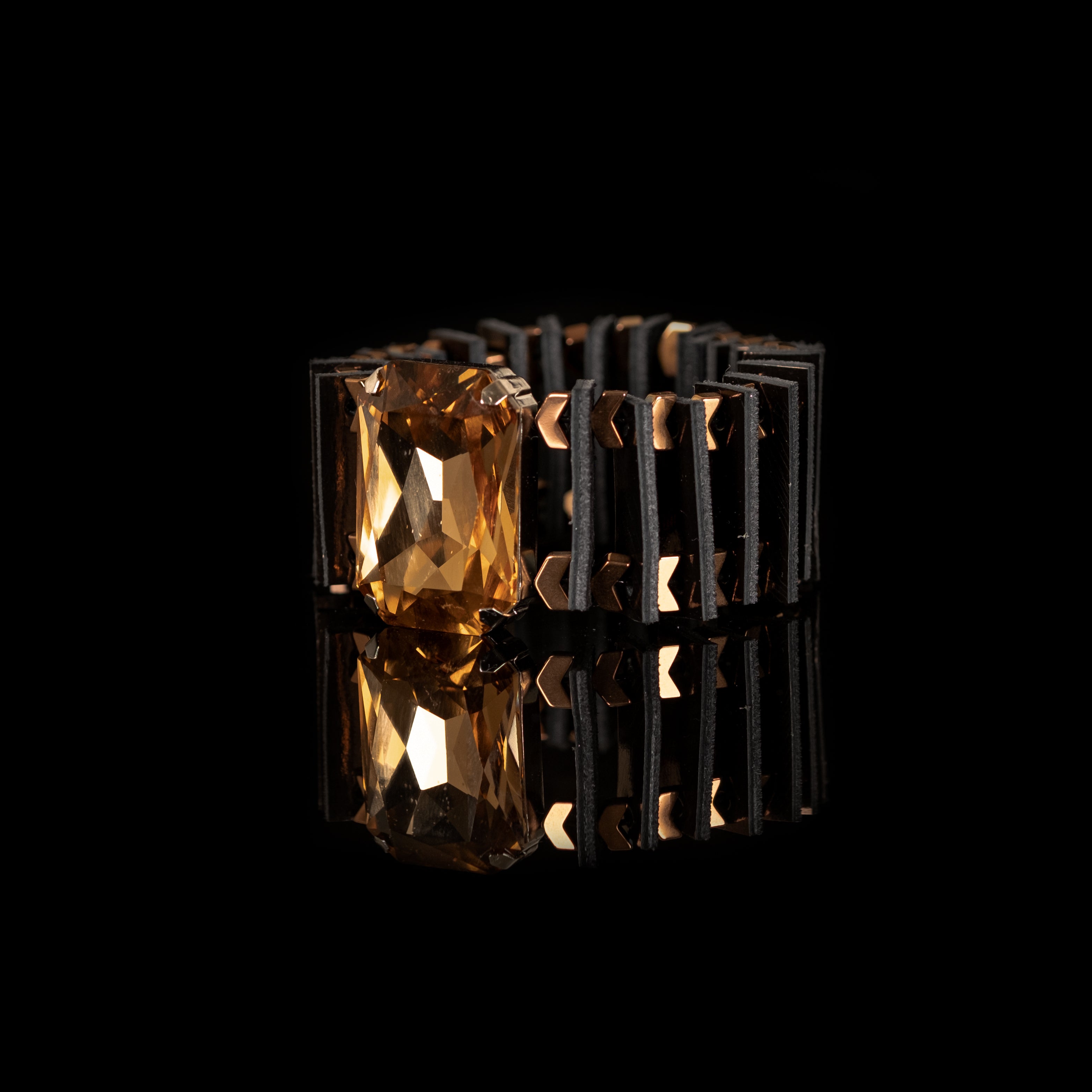 Black architectural leather cuff bracelet with large amber crystal centerpiece, handmade statement bracelet by THE DARK