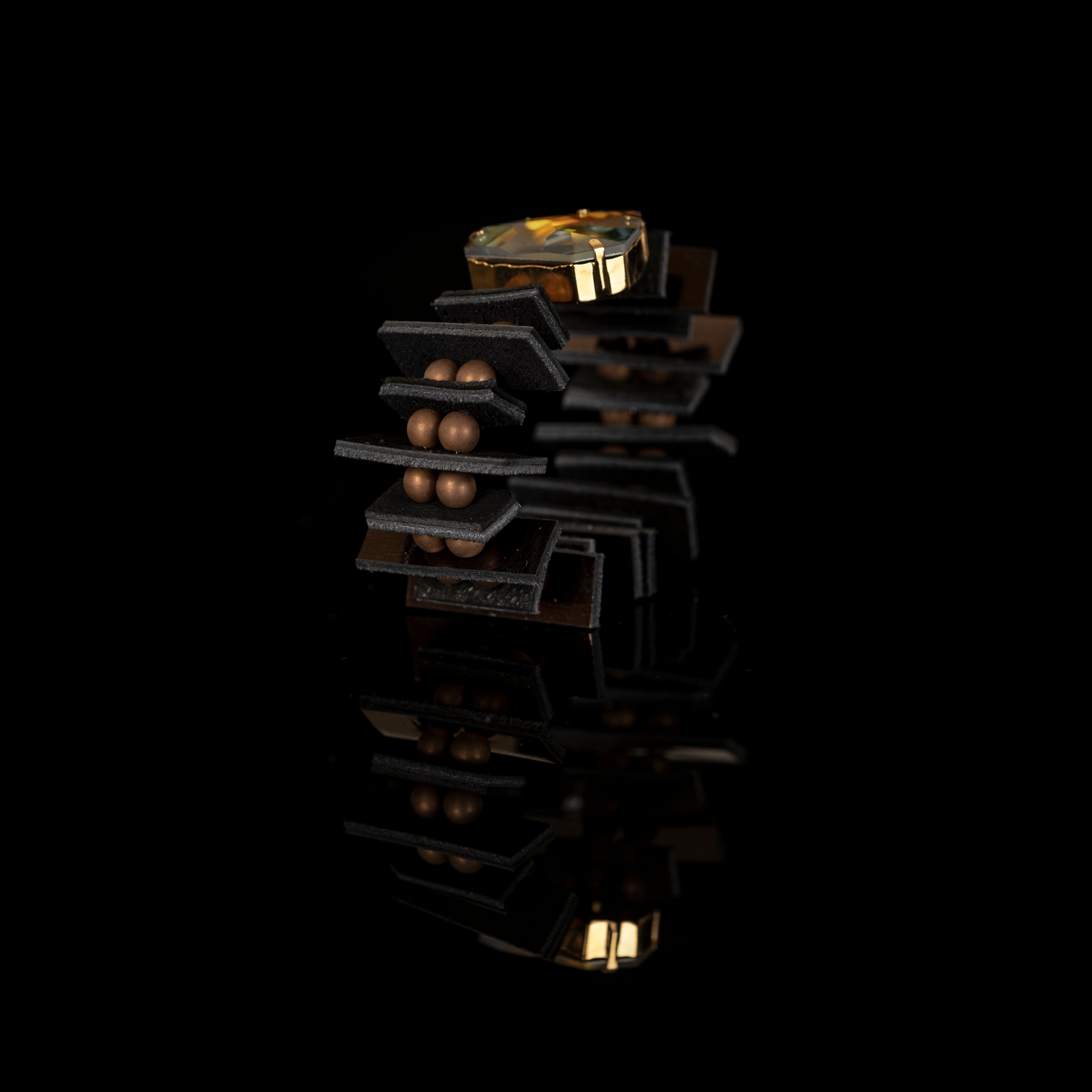 Black architectural leather bracelet with aurora crystal centerpiece and layered leather panels, handmade statement cuff by THE DARK