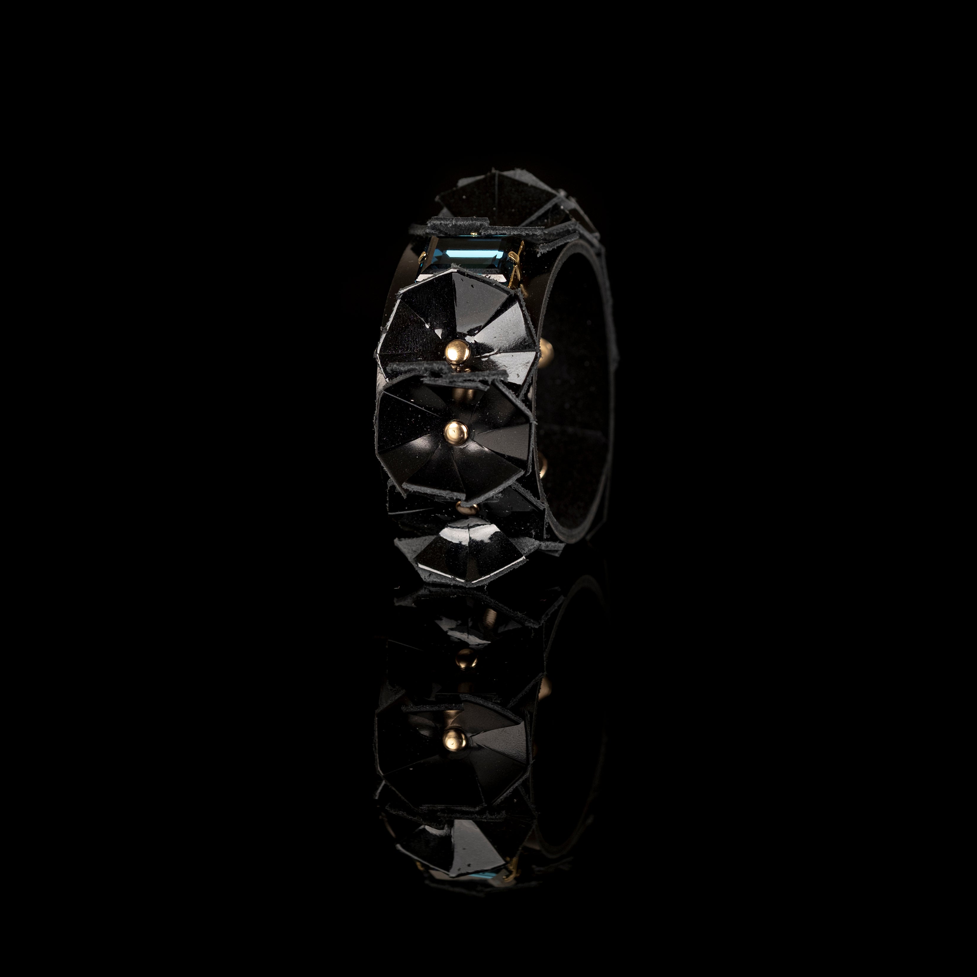 Black faceted leather cuff bracelet with geometric panels and crystal centerpiece, handmade statement bracelet by THE DARK