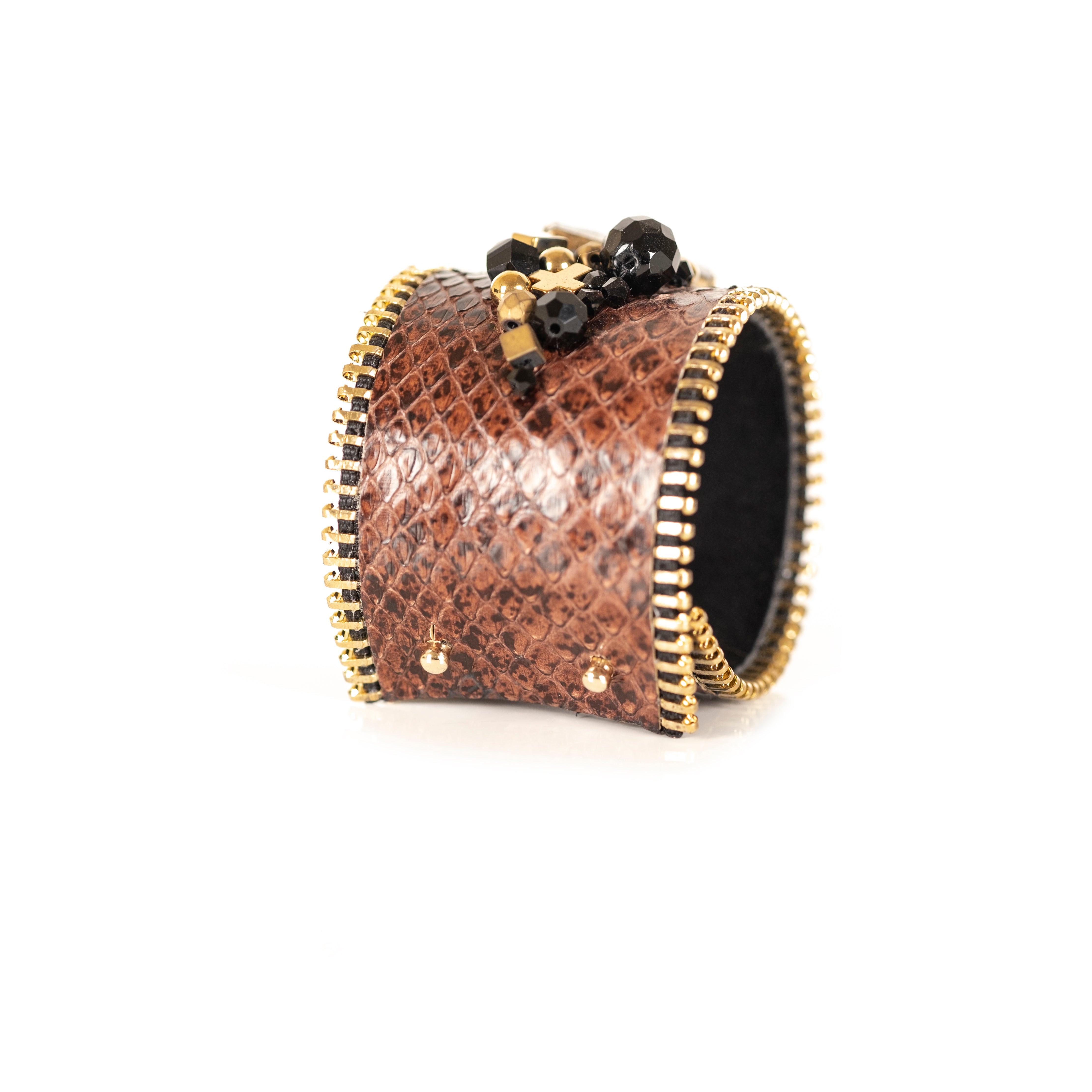 Brown python leather cuff bracelet with amber crystal centerpiece, gold zipper edges and bead embellishment, handmade by THE DARK