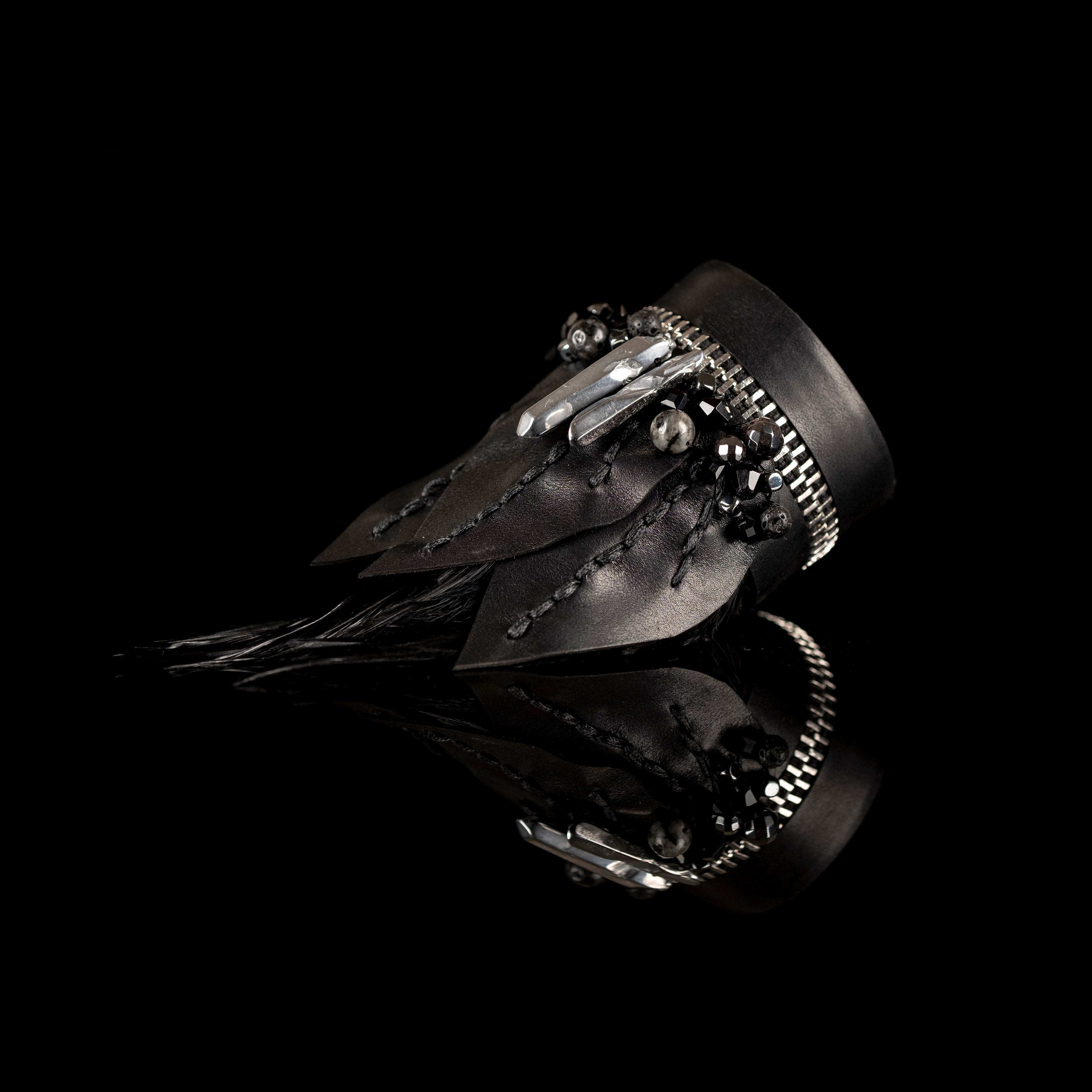 Black leather feather bracelet with crystals and zipper edge detail, handmade avant-garde statement bracelet by THE DARK