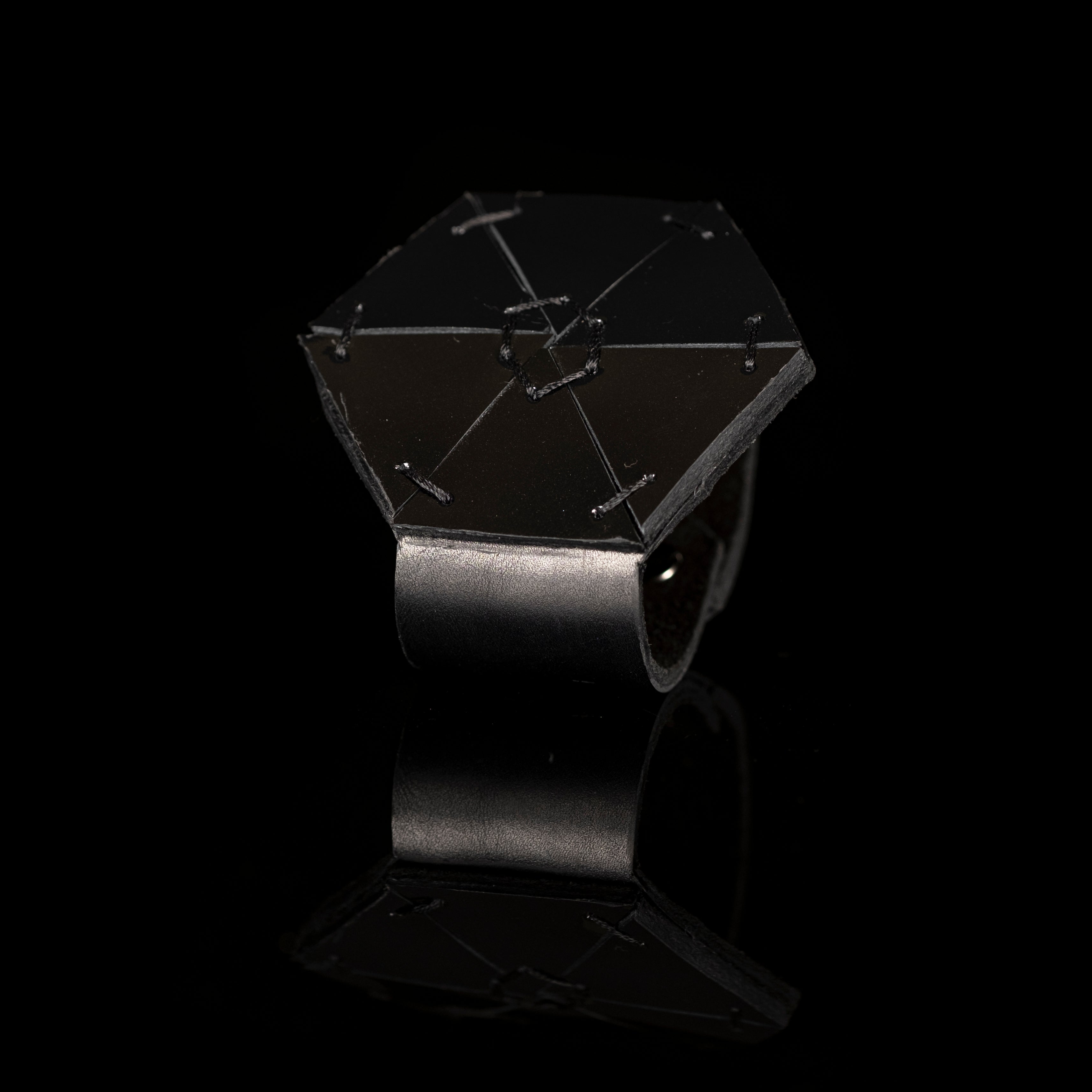 Black geometric leather cuff with hexagon armor structure, handmade architectural statement bracelet by THE DARK