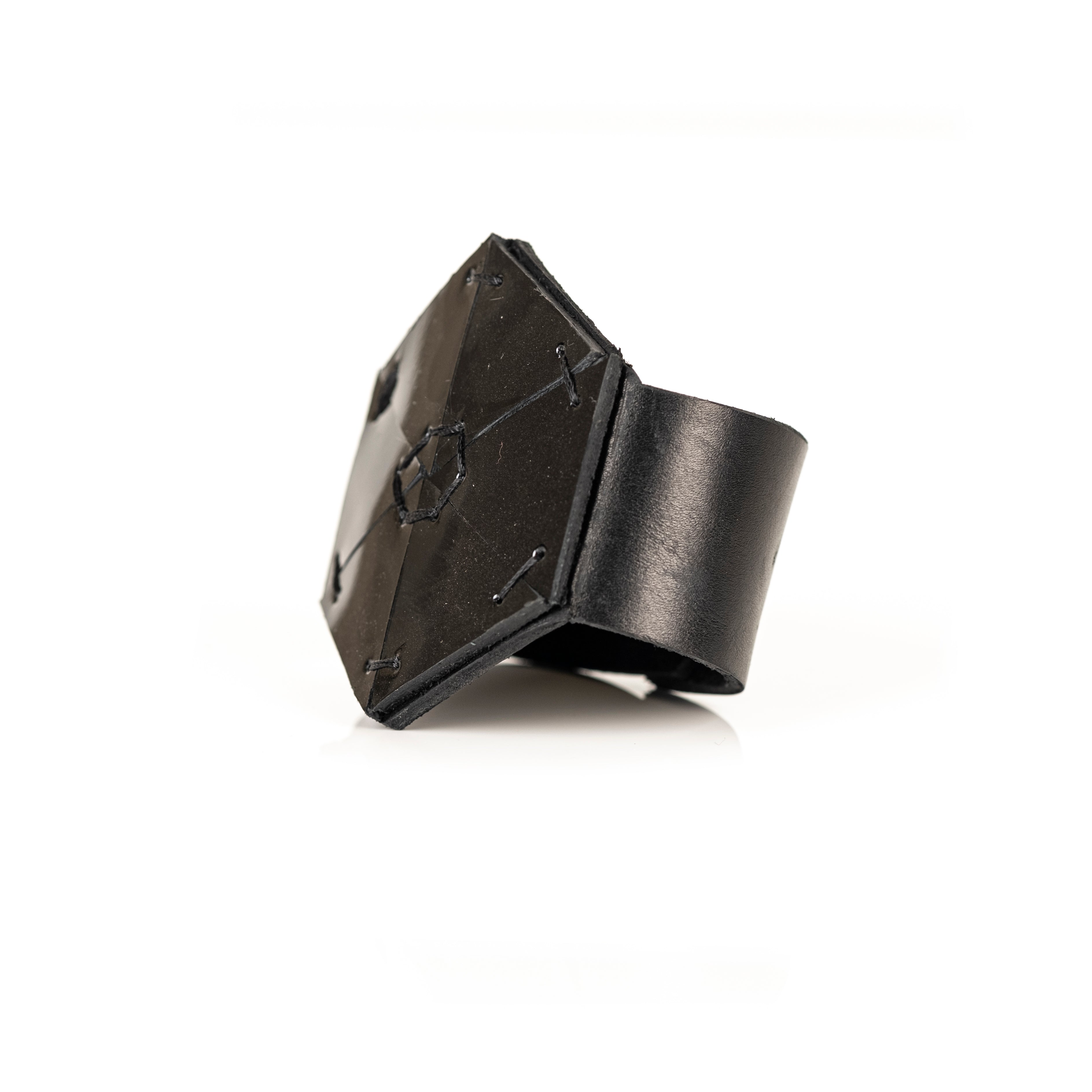 Black geometric leather cuff with hexagon armor structure, handmade architectural statement bracelet by THE DARK