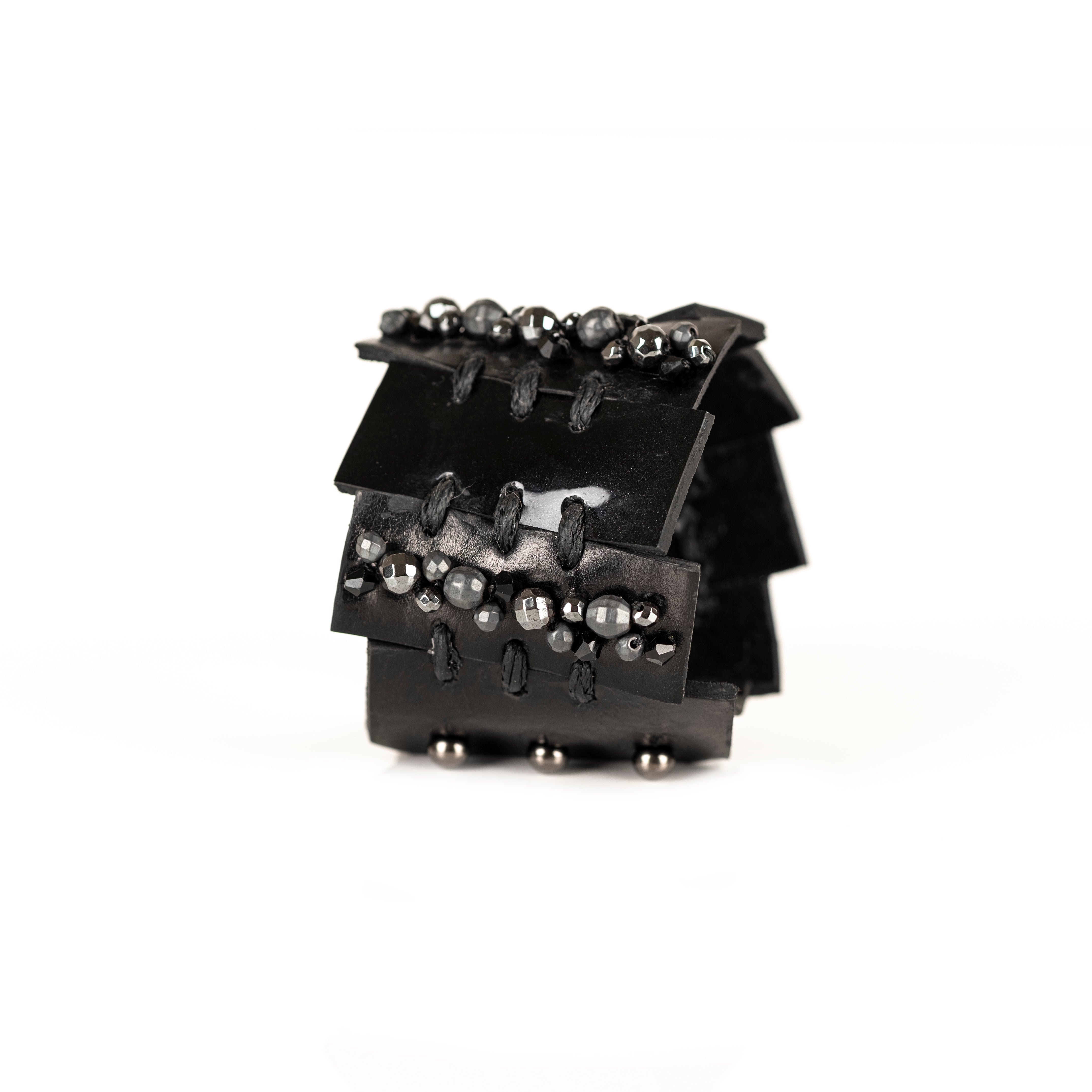 Black leather layered armor cuff bracelet with stitched panels and faceted metallic beads, handmade statement bracelet by THE DARK