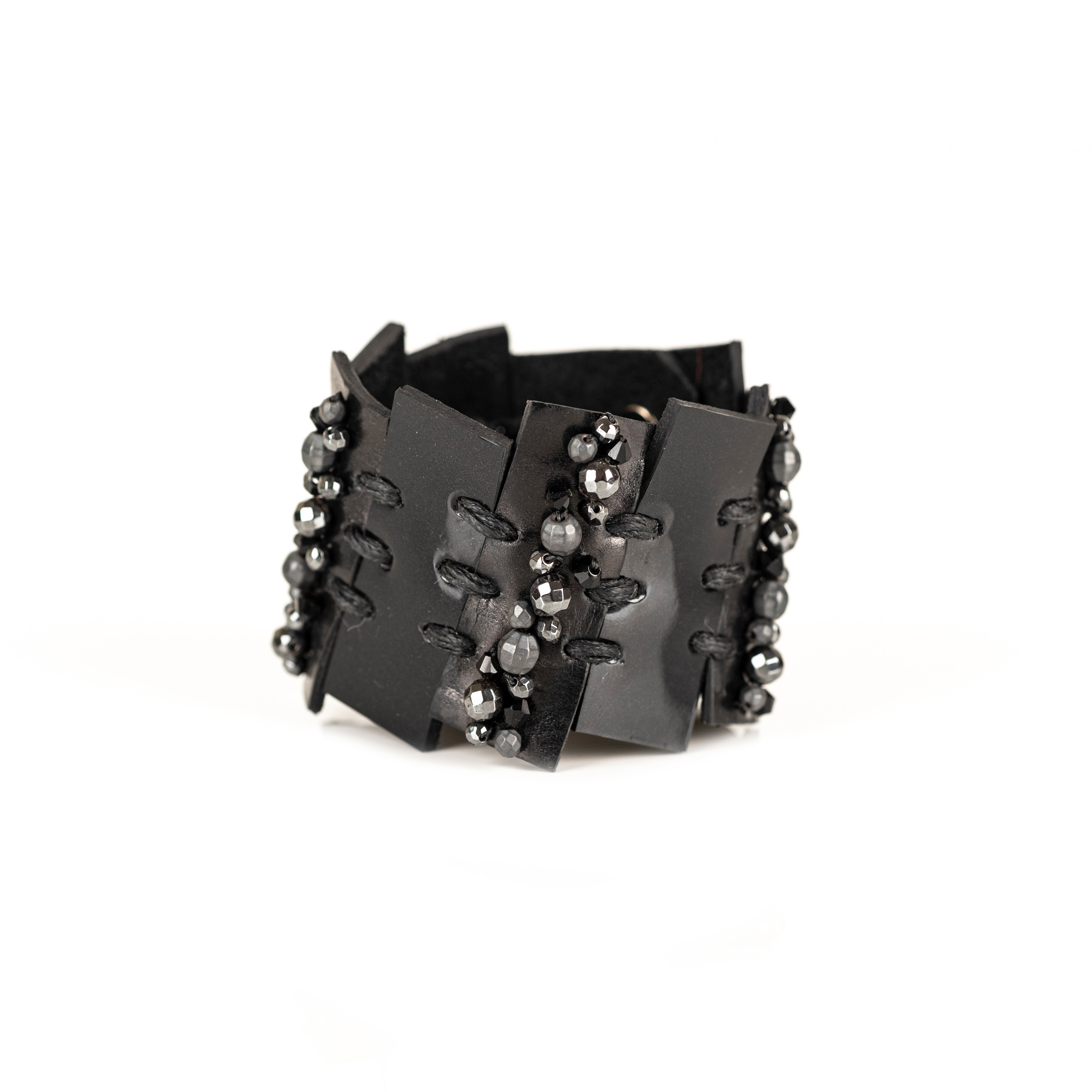 Black leather layered armor cuff bracelet with stitched panels and faceted metallic beads, handmade statement bracelet by THE DARK