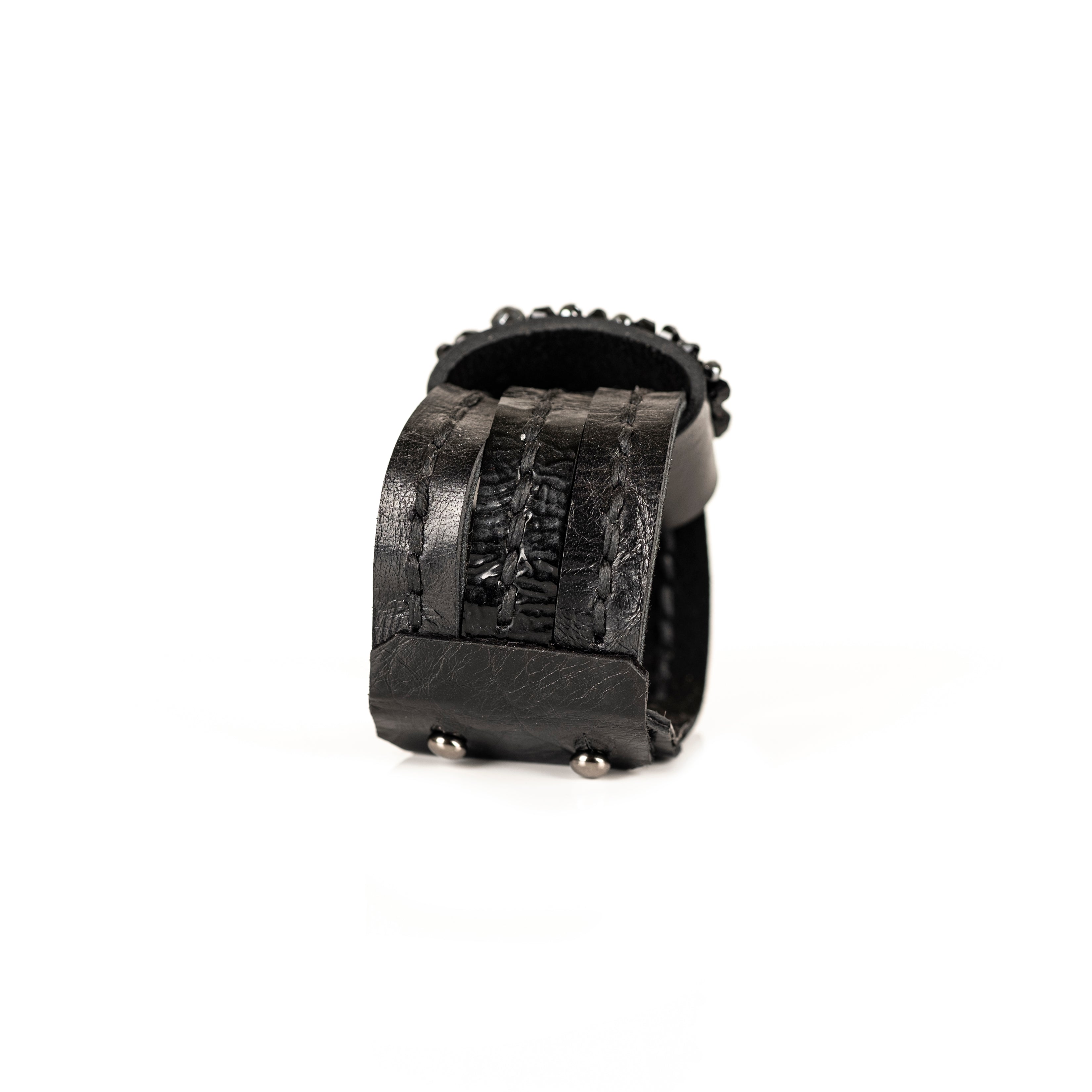 Black leather cuff bracelet with dense black crystal crown and layered textured leather bands, handmade bracelet by THE DARK