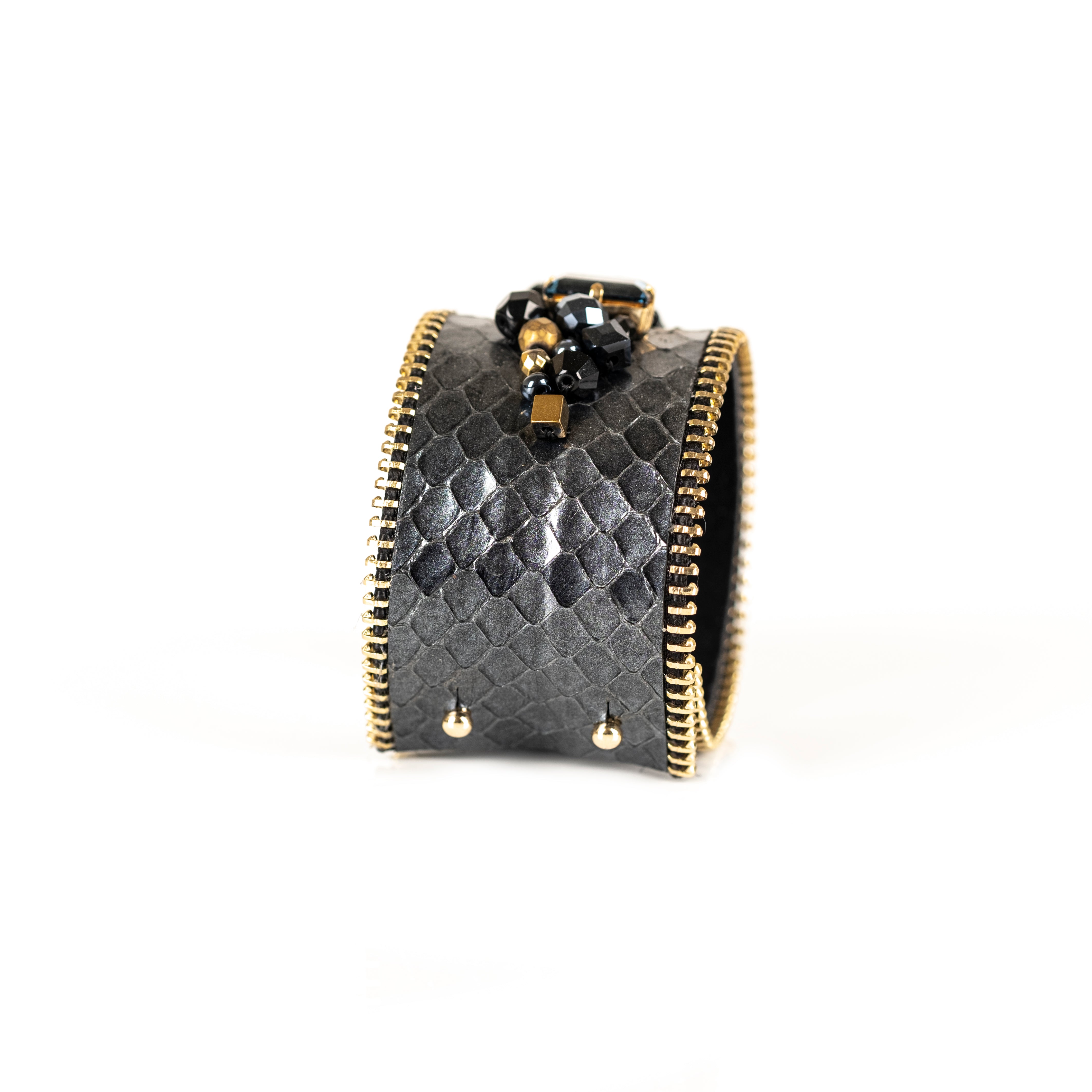Grey python leather cuff bracelet with crystal and black gold bead embellishment and zipper edges, handmade statement cuff by THE DARK