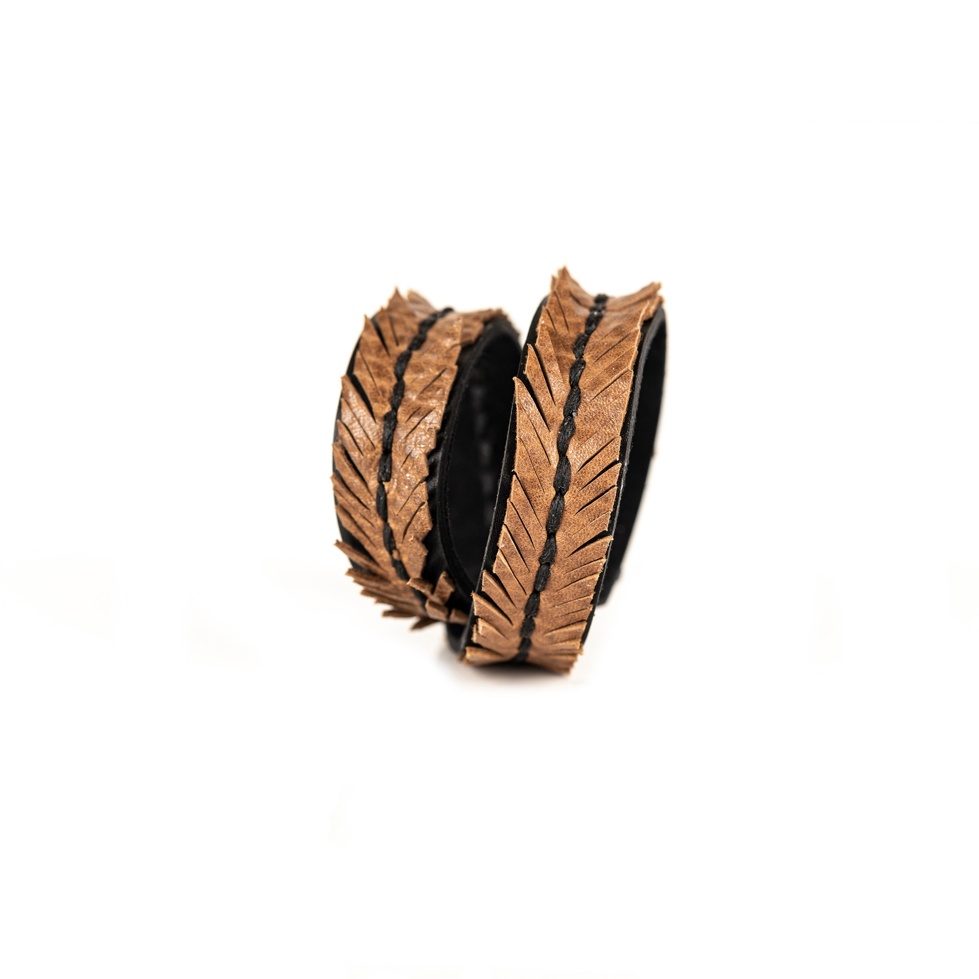 Tan leather wrap bracelet with feather textured pattern and braided center detail, handmade bracelet by THE DARK