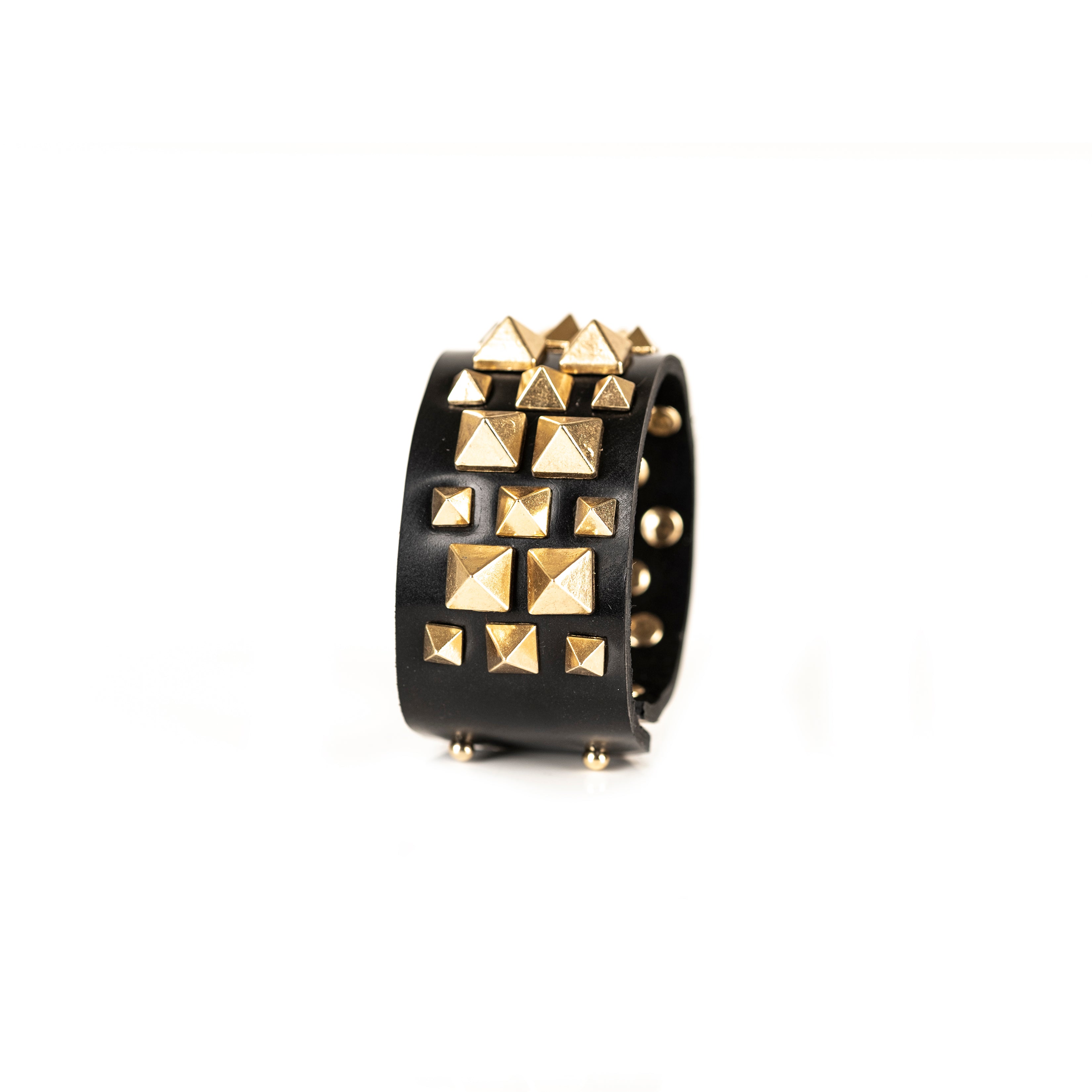 Black leather cuff bracelet with gold pyramid stud pattern, handmade statement bracelet by THE DARK