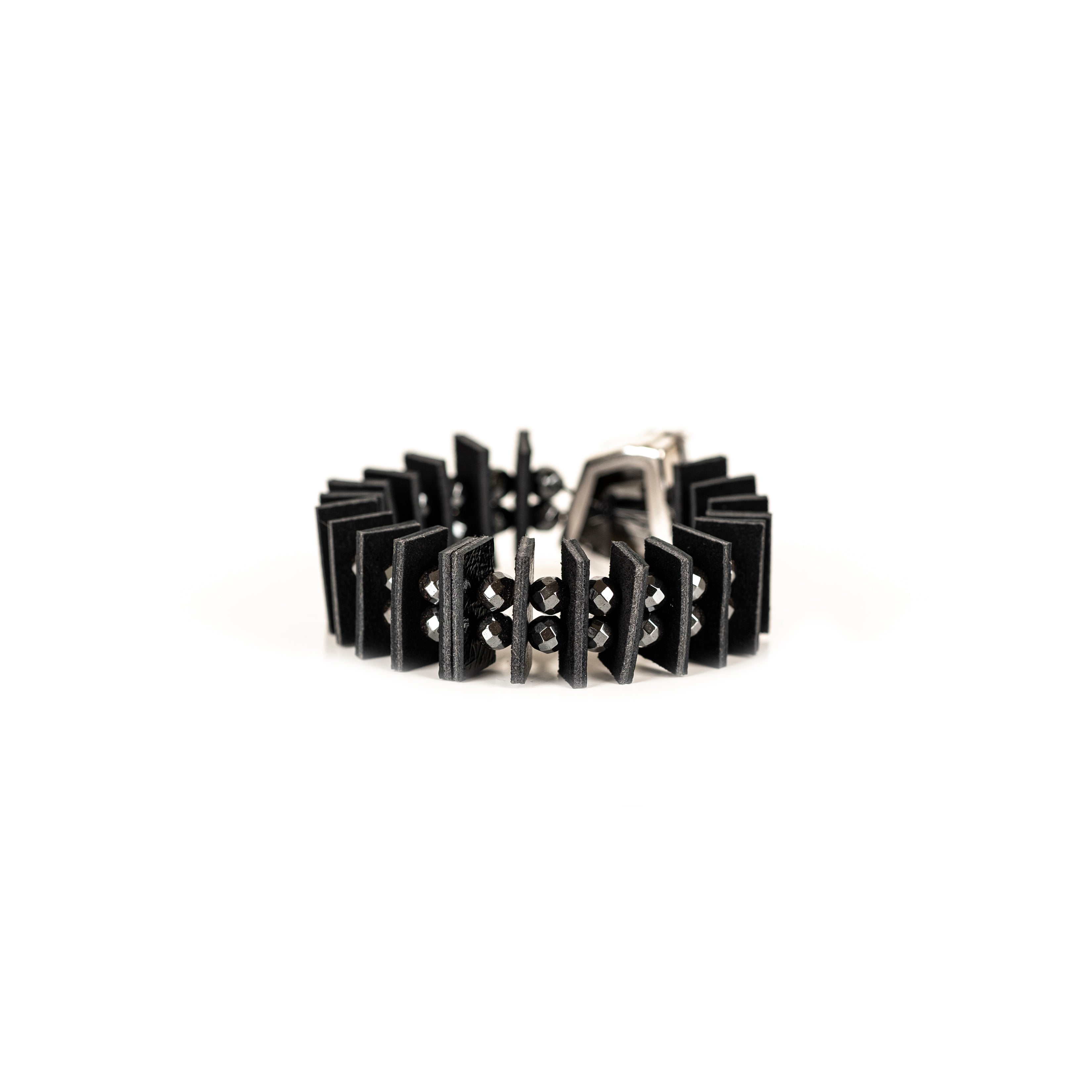 Black geometric leather bracelet with large faceted crystal and layered leather segments, handmade statement bracelet by THE DARK